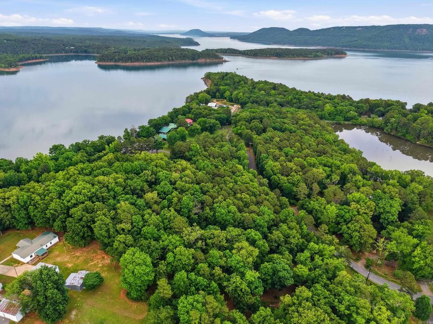 Great area to purchase property for a lake home on Greers Ferry Lake. Property has a Clinton address, paved county road bordering property frontage, some underground utilities, an upward-sloping, tree filled lot for privacy and this location is close to Choctaw Marina with all of its amenities. This lot has been surveyed and when you come to look there are wooden stakes marking corners and my company's real estate sign. Please call 501-940-9155 for additional information. Lots are in Clinton School District.
