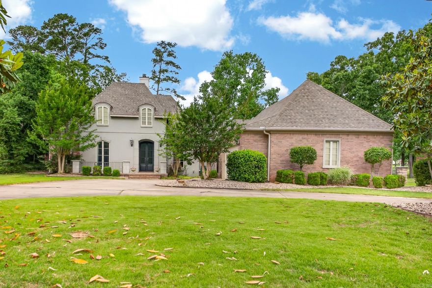 Stunning golf course home on the 18th hole offering 4 bedrooms, 3 baths and 2729 sq ft of beautifully designed living space.  From the moment of arrival, the impressive 8' tall double iron entry doors greet you and walking in you'll find a formal living room and dining space, 12' ceilings with crown molding, custom woodwork in the living room and 2 fireplaces that create warmth & charm throughout the home - one in living room and one in primary bedroom.  Primary bedroom also has sitting area and 2 closets. No carpet. This home also includes a sparkling swimming pool with slide, a sprinkler system, circle driveway, iron fencing, covered patio and a private backyard overlooking the 18th hole.  Additional features are 2 car garage, golf cart garage with workshop, new roof in 2025.