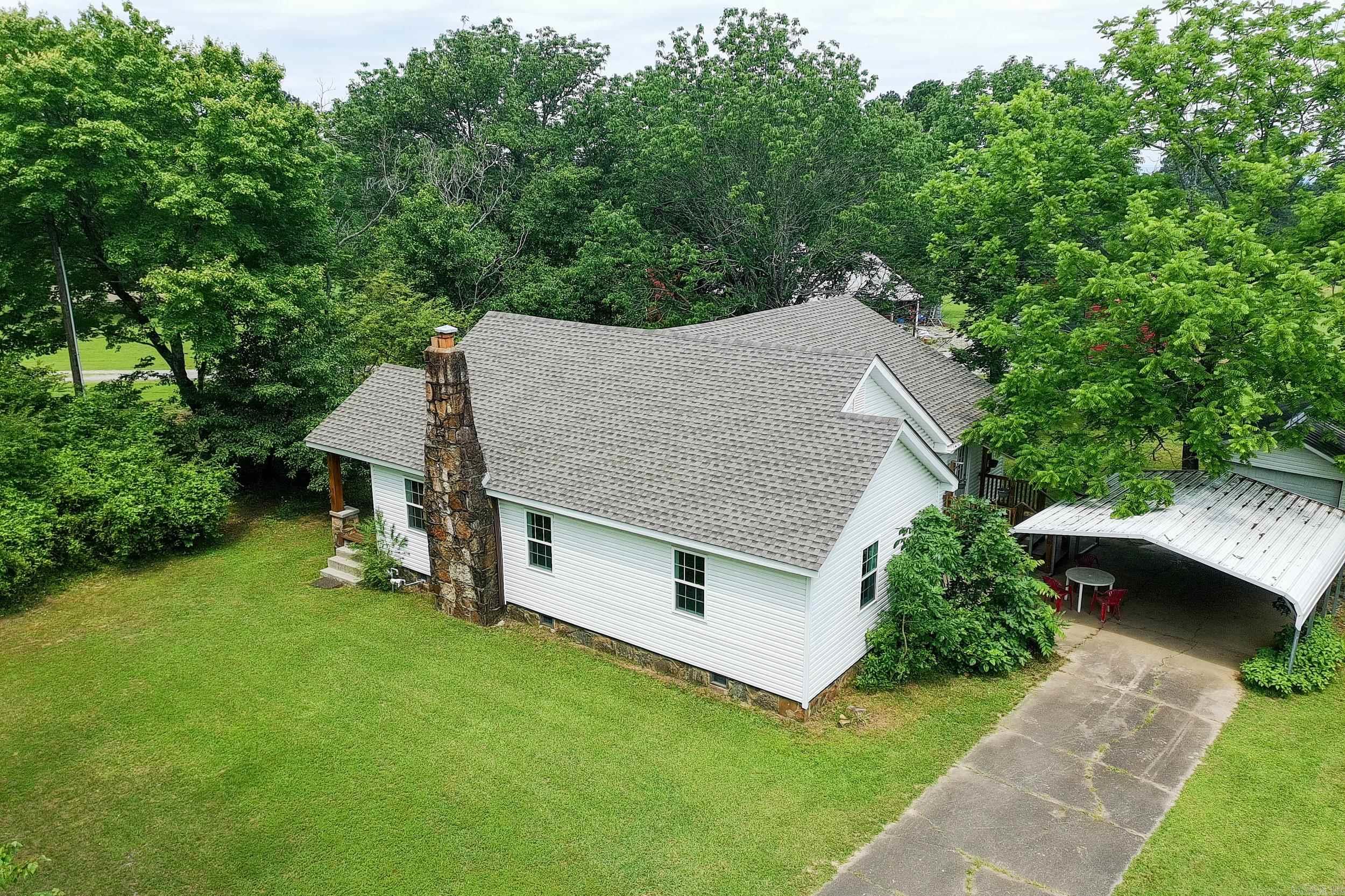 Welcome to this beautifully transformed home where timeless charm meets complete renovation. Nestled on a serene 1.5-acres, this move-in ready property offers space, versatility, and a long list of brand-new upgrades. Inside, you’ll find two generously sized bedrooms and two distinct living areas—one of which can easily be converted into a third bedroom, office, or hobby space to suit your lifestyle. The home has undergone a top-to-bottom renovation, featuring new sheetrock, all new paint, new plumbing and wiring, and a new hot water heater, new 36,000 btu mini split, ALL new appliances ensuring comfort and peace of mind for years to come. Step outside to enjoy the wide-open space, ideal for gardening, entertaining, or simply relaxing in nature. This property truly shines with major exterior improvements, including a new roof, windows, doors, siding, new drain waste vent system and a brand-new water well complete with pump and pressure tank. The detached garage and the barn offers great potential for animals, equipment, or creative projects. Whether you’re looking for a quiet country retreat, room to grow, or a place with character and flexibility, this property is a must-see.