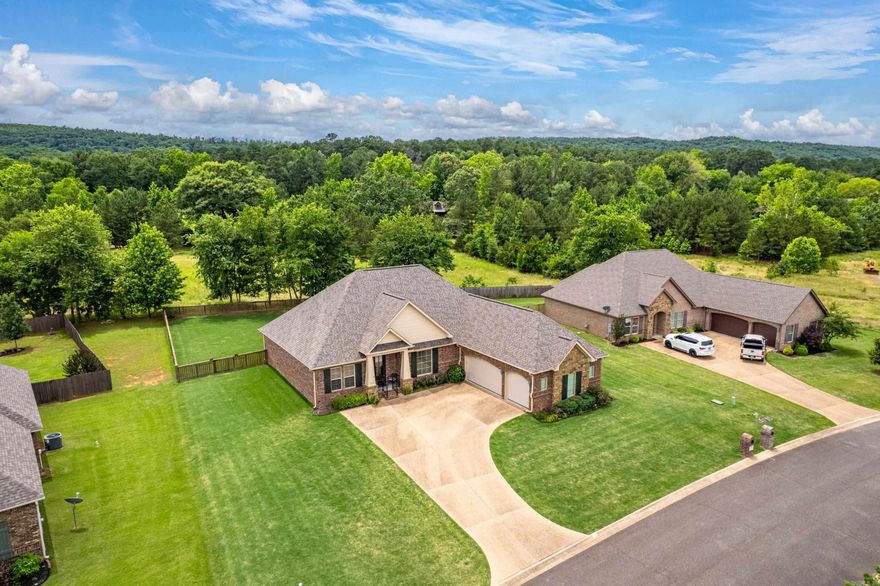 **Charming Elegance Meets Modern Luxury in Glencairn Subdivision**  Welcome to your dream home, nestled in the highly sought-after Glencairn Subdivision! This exquisite residence, meticulously crafted by the renowned Carriage Custom Homes, embodies upscale living at its finest. As you step inside, you're immediately greeted by an inviting foyer that flows seamlessly into a spacious open-concept layout. The living area is filled with warm natural light, showcasing stunning custom cabinetry and elegant finishes that enhance every corner of this beautiful home. The heart of the home—an elegant kitchen—is adorned with granite countertops, perfect for culinary adventures or entertaining friends. With a large pantry storage closet just off the kitchen you will have plenty of area to keep your space organized. This home features an expansive utility room equipped with a sink—a dream for those who love organization or need extra space for laundry tasks. With even more storage solutions throughout the home, including the partially floored attic. —an exciting opportunity waiting for your personal touch. Adjacent to the kitchen..Cont'd...in Agent Remarks