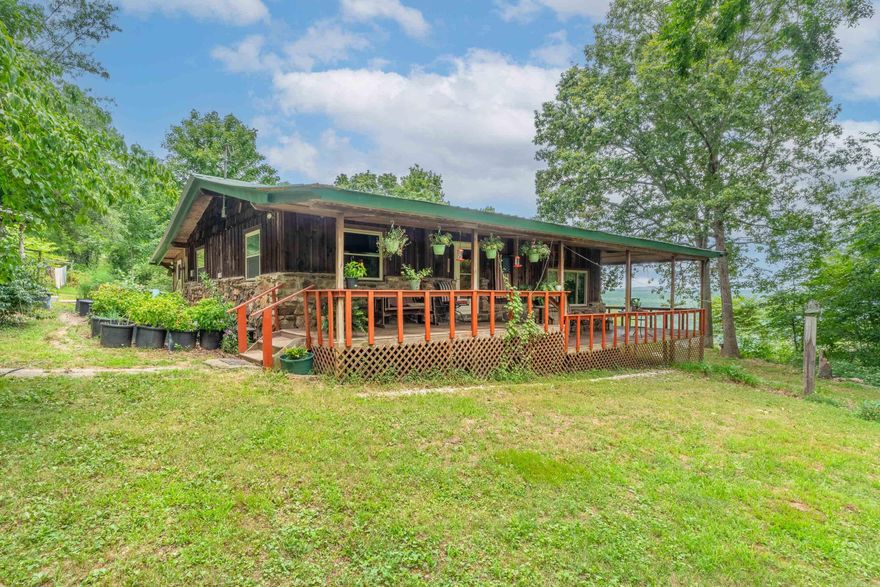 Tucked away at the end of a quiet country road, this secluded 2-bedroom, 2-bath wood home offers the ultimate in peace, privacy, and natural beauty. Set on 84 sprawling acres in the heart of the Ozarks, this one-of-a-kind property is a nature lover’s dream with abundant wildlife, a spring-fed water supply, and stunning mountain views in every direction.  The warm and inviting home features rustic wood accents throughout, spacious living areas, and large windows that bring the outdoors in. Step outside to enjoy the sounds of nature, relax on the porch, or explore your own private pond and forested trails. A barn adds charm and functionality—perfect for livestock, storage, or converting into a workshop or guest space.  Whether you're looking for a peaceful homestead, a weekend getaway, or a hunting retreat, this Ozarks gem checks all the boxes. Properties like this—where privacy meets pristine natural beauty—are rare. Come experience it for yourself. Looking for less land? This is also listed with the house and 40 acres: MLS #25007742.
