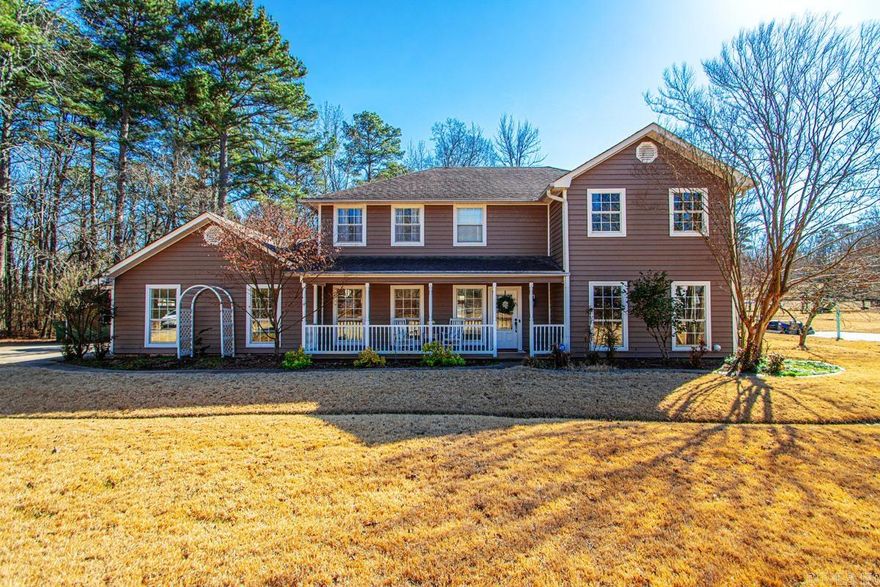 Welcome to the perfect blend of country living and city convenience! This beautifully maintained 4-bedroom, 2.5-bath home sits on over an acre, offering space, privacy, and room to breathe while still being just minutes from town.  Inside, you’ll find a warm and inviting living area with a cozy fireplace—perfect for gathering with family and friends. The spacious primary suite is a true retreat, featuring its own fireplace and a private balcony overlooking the backyard.  Step outside to your fully fenced backyard oasis complete with an in-ground pool, ideal for entertaining or relaxing all summer long. Thoughtfully designed custom water drainage provides added peace of mind. The home also offers abundant storage throughout and a generator for extra security and convenience.  If you’re looking for acreage, charm, and a backyard built for making memories, this one checks all the boxes!