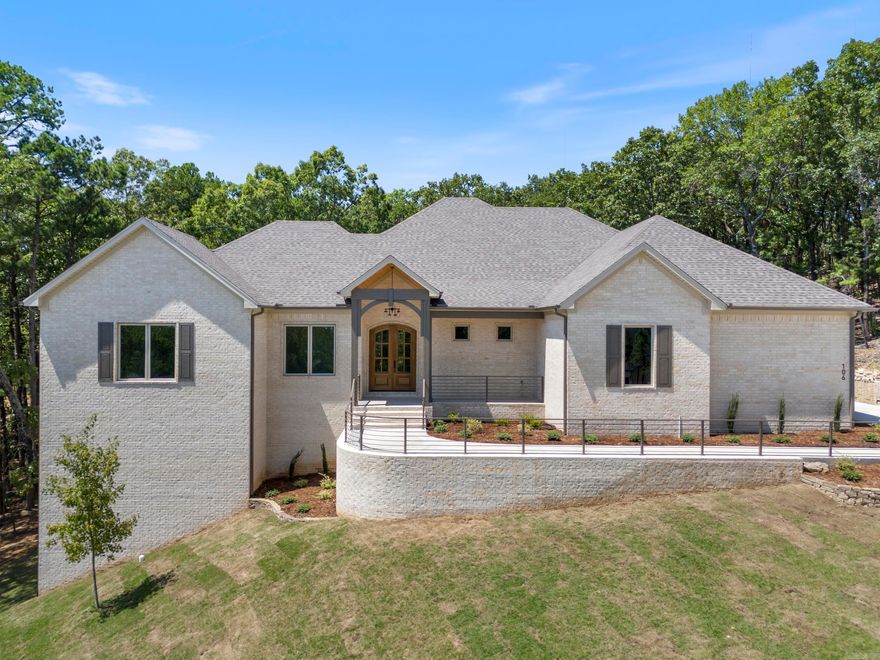 Welcome to your dream home! This luxurious 5-bedroom, 4.5-bathroom masterpiece by Turner and Sons Construction in Bear Den Estates exudes elegance and comfort. The premium kitchen is a culinary enthusiast's delight, featuring top-of-the-line appliances and countertops. The spa-like primary bathroom is a serene retreat, boasting a soaking tub and a spacious walk-in shower. With two expansive living areas, there's ample room to gather or unwind. Sip fine wines from your private cellar and entertain in style. The two lush outdoor living areas beckon with a beautiful green space backdrop, ideal for entertaining. High-end finishes, 2 fireplaces, plenty of space and more make this home truly exceptional. Your sanctuary awaits!