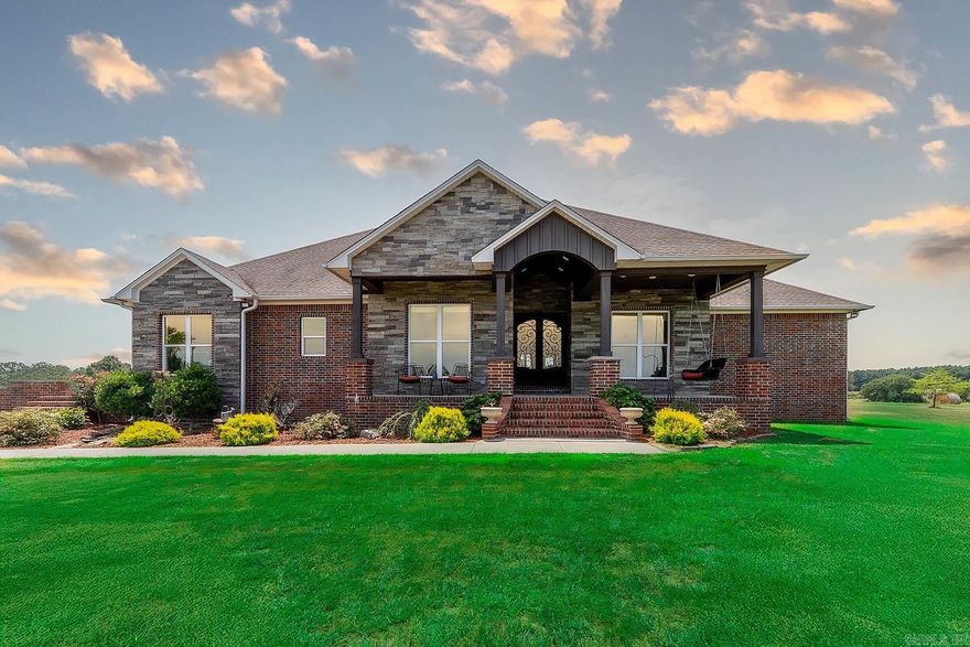 Custom Home on 40 Acres in Hector, Arkansas – Built in 2020  Experience modern country living on 40 beautiful acres with this 3,485 sq ft custom home in Hector, AR. Built in 2020, it offers a spacious layout, high-end finishes, and thoughtful design throughout. The open-concept living area features a custom entertainment center, while the kitchen shines with granite countertops, custom cabinets, and a walk-in pantry.  The home includes 4 bedrooms and 3 baths with quartz counters and walk-in showers. The master suite features a large walk-in closet and spa-like bath. A private mother-in-law suite and an entertainment room add flexibility. The home is fully wheelchair accessible and includes a heated/cooled 2-car garage.  Outdoors, enjoy a covered porch, level yard, mature landscaping, cattle-tight fencing, and a scenic pond. High-speed fiber internet keeps you connected. Choose from 40, 76, or all 96 acres—including fields, woods, and a second pond. Just minutes from the Ozark National Forest, Illinois Bayou, and Russellville.