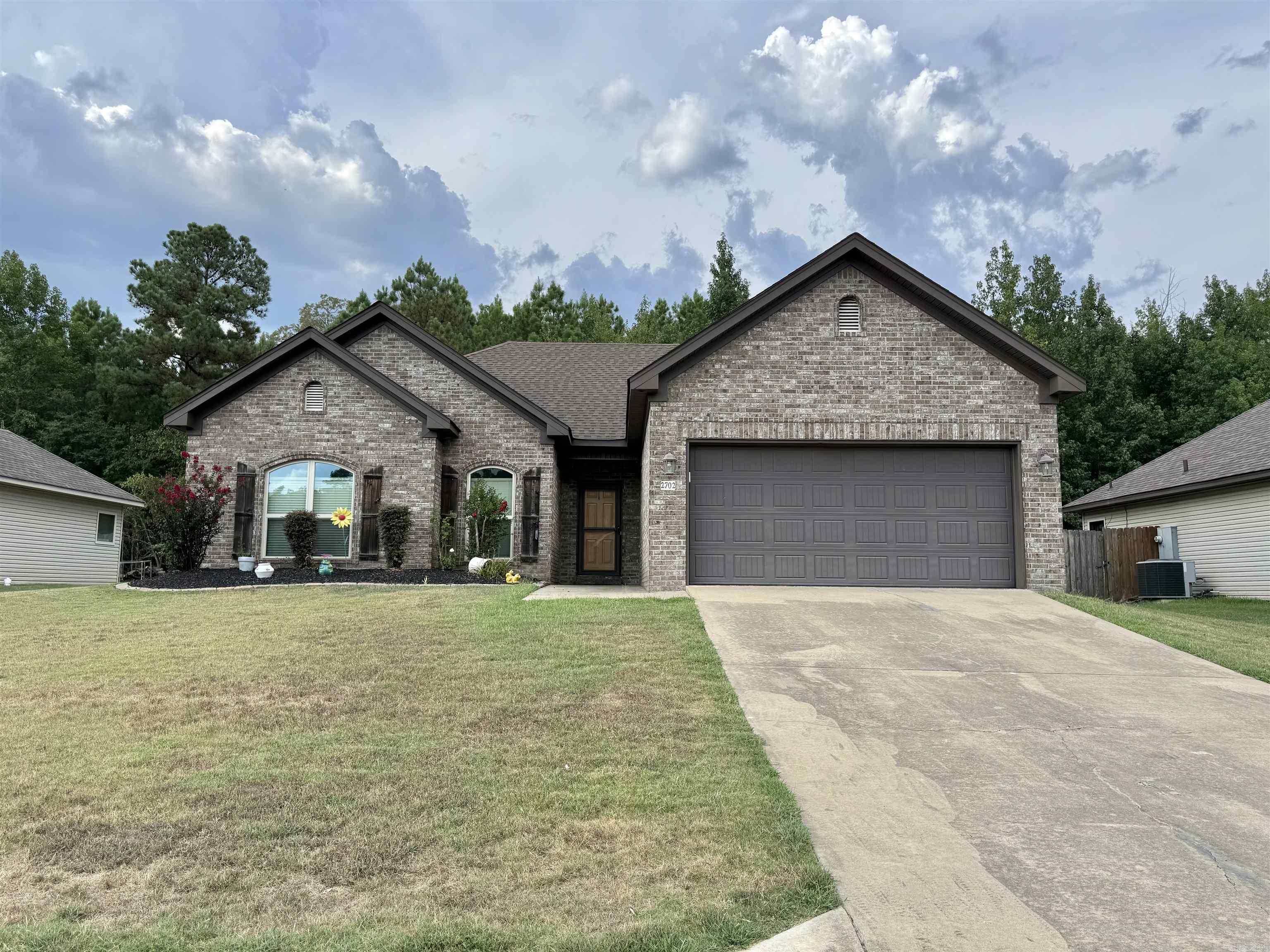 Amazing well kept 3 bedroom 2 bathroom home in Bryant. This home has tons of updates!!! New windows throughout entire home with light tint and block sound as well. New paint, garbage disposal, microwave, storm doors for front and back, shower heads in both bathrooms. New landscape and architectural blocks around flowerbeds and new fencing in certain areas where needed. New electric key pad for front door and all new garage door motor, springs, chain and openers with camera and WiFi access. New light fixtures throughout the house. Don't miss this amazing home!!!