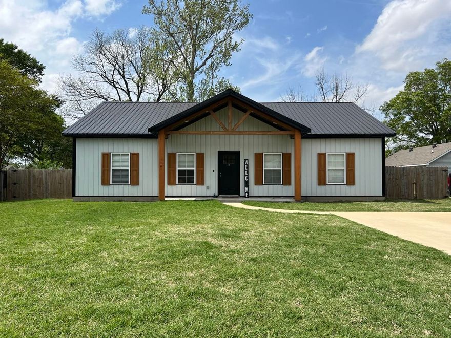 Beautiful white/black shop house in Bay AR, about 3 years old. This home has 3 roomy bedrooms, 2 full bathrooms, front and back porches, and a privacy fenced backyard. The home is a split bedroom plan with the laundry room and tankless gas water heater located on the Primary bedroom side. The suite has a double vanity with drawers and linen storage, a separate water closet, tub/shower unit, and nice walk-in closet. This home has easy-clean stained concrete flooring throughout, and beautiful paint colors have been chosen. The dining area has French doors opening to the back porch and fenced backyard. You should tour this home in person.