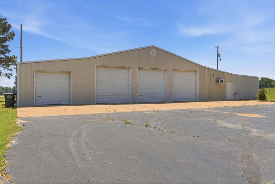 Great opportunity with endless potential in a prime Beebe location! Shop, parking lot and additional building is on 1.25 acres. This property features an approximately 3,458 SF commercial-style shop building complete with electricity, bathroom, multiple bays, and automatic garage doors. Whether you need space for a business, storage, equipment, hobbies, or future investment opportunities, this property offers flexibility and functionality. There is also an additional smaller building on the property previously used as a beauty shop that could serve a variety of purposes including office space, studio, storage, or small business use. Excellent location with tons of opportunity for residential, commercial, or mixed-use potential.