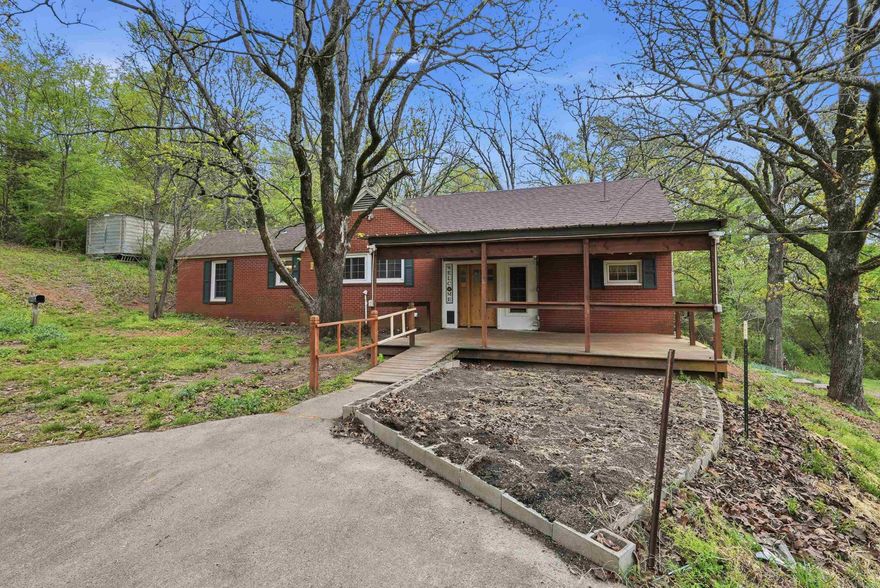 Country charm, beautiful views, and room to live the lifestyle you’ve been dreaming about. This inviting farmhouse sits in a peaceful setting surrounded by mature trees, open pasture views, and space to make it your own. Stepping out of the car, you’ll see what makes this property so special — room for horses, goats, chickens, and more, along with a 3-stall horse barn and an RV parking pad both setup with electric. The large deck sets the tone for those evenings and weekends, while inside you’ll find a spacious living area with beautiful real hardwood floors and a cozy fireplace that adds warmth and character. Whether you are looking for a homestead, hobby farm, or simply a place with more breathing room, this property offers flexibility and charm in all the right ways. Updates include HVAC system with air filtration system (2015) Architectural Roof 2015, HWH 2014, Extra Barn and Additional Storage on the property as well. Upgrades to electrical and Plumbing and Bathrooms. Don't miss seeing this home!