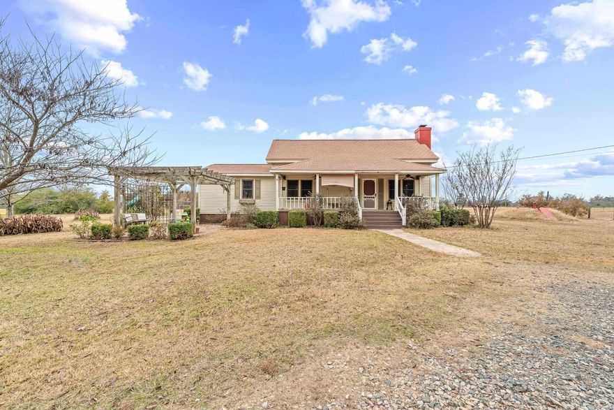Check out this charming farmhouse built in the 1930s.  This home features 1646 sq.ft. of well-maintained living space, a nice large kitchen, a free-standing wood-burning stove.   Additionally, this property includes an outdoor storage building/workshop, chicken coops, and a storm cellar, all sitting on 4.02 acres mol within the city limits of Lockesburg, AR 71846