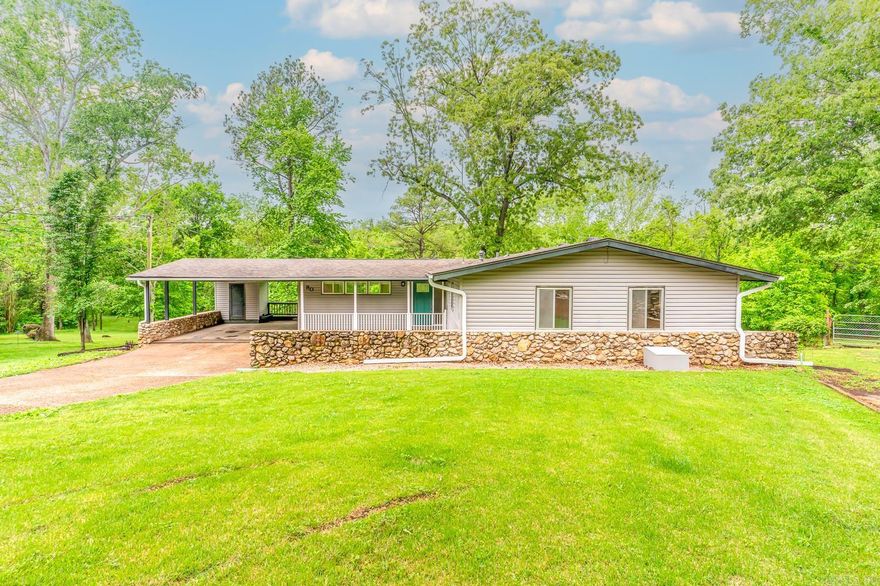Welcome to Market 80 Altakima Cir of Cherokee Village, AR. Situated at the end of a cul-de-sac on .47 +/- acres sprinkled w/ mature shade trees is a 2,784 Ranch Rambler w/ full walkout basement. The exterior is wrapped in vinyl & stone, topped with a recently updated roof, and accented by a large wooden deck, 2 car carport w/ storage room, and guttering. The interior holds 4 bedrooms, 3 bathrooms, 2 living areas, eat-in kitchen, and plenty of storage. The Sellers have made many improvements to the property including: flooring, drywall, cabinet & countertop upgrades, painting inside & out, guttering, french drain and more.  You'll love the walking trail that will lead you straight to the South Fork River & Flathead Bridge, large windows in the kitchen that offer tree lined views, wildlife of deer, birds, rabbits, and fox that frequent the property, fully finished, heated & cooled walkout basement, massive walk-in closet, and 2 living areas, Area amenities include: 7 lakes, South Fork River, 2 golf courses, trails, waterfalls, and more. Call today to schedule your tour and make this house your home, home away from home, or next addition to your rental portfolio.