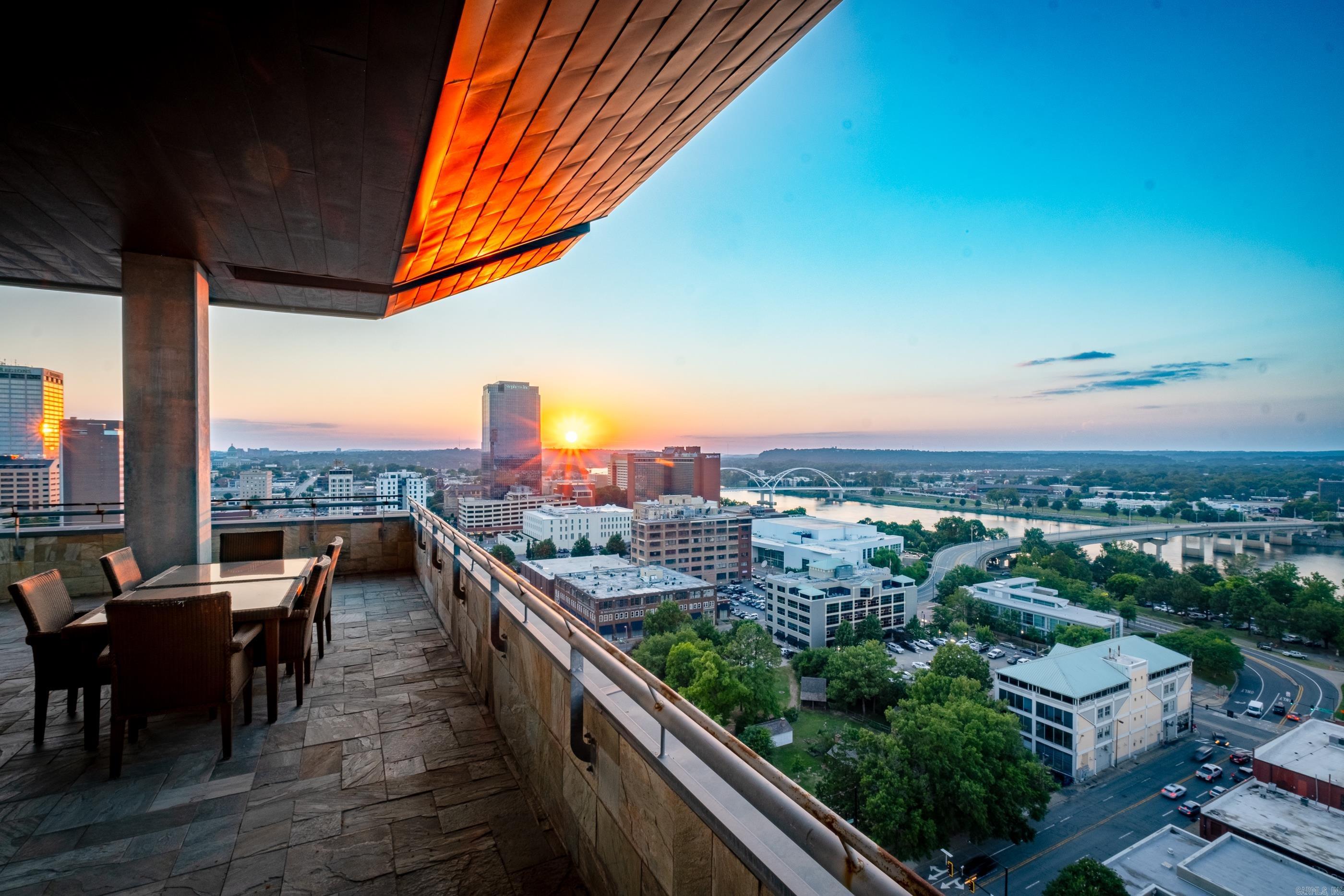 Luxury living in the heart of downtown Little Rock! This penthouse condominium has never before been offered for sale. It showcases the best views of Little Rock and faces North & West. Immaculate and completely remodeled with designer touches, this 3 bedroom, 3 & ½ bath is truly one-of-a-kind. Two separate entry foyers open to an elegant living/dining space with custom tray ceilings, flooded with natural light and floor-to-ceiling windows that showcase the Arkansas River and City of Little Rock. Gorgeous formal dining room with stunning double chandeliers. Walk outside to a massive flagstone wrap-around balcony. Spectacular custom chefās kitchen is anchored w/stone countertops and Viking appliances. Lovely breakfast bar adds loads of charm. Richly appointed spaces include sophisticated art. The indoor-outdoor spaces blend perfectly, making it an entertainerās dream! Two parking spaces on 2nd level next to the entrance. The property is being sold fully furnished. There is concierge, security, a pool, dog walk, exercise room, and excellent restaurant. This is a unique opportunity to own a one-of-a-kind, exceptional luxury property! Agents, see remarks.