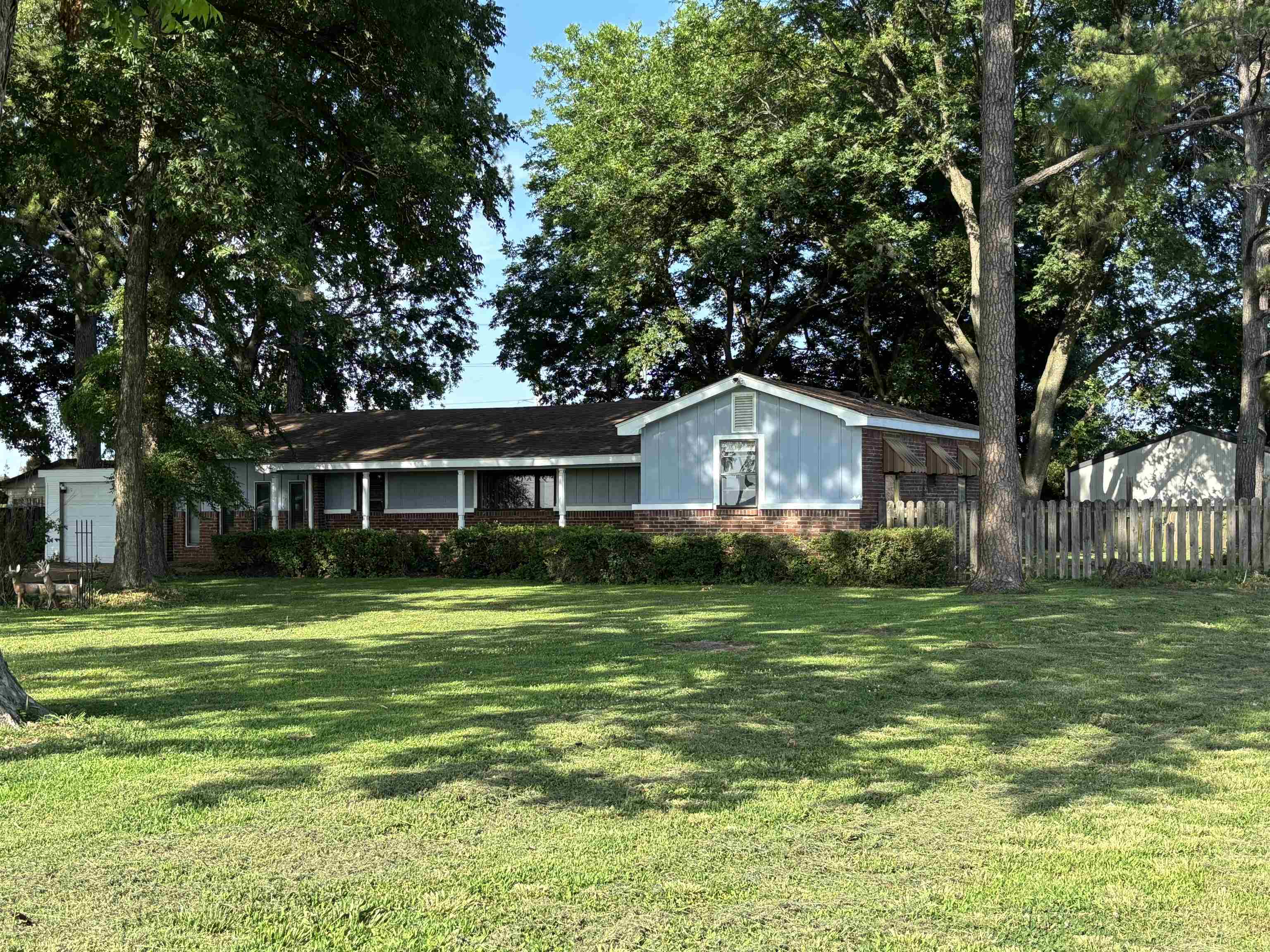 Charming Country Home with Shop & Outbuildings – Perfect Starter or Downsizer! Welcome to peaceful country living just outside of Blytheville! This cozy 2-bedroom, 1-bath home is full of potential and charm. Nestled among beautiful mature trees, the property offers shade, privacy, and a serene setting you’ll love coming home to. Enjoy the bonus of a large shop—perfect for hobbies, storage, or a small business—as well as two additional outbuildings for extra space and functionality. Whether you're just starting out, looking to downsize, or searching for your next investment opportunity, this property checks all the boxes. Don't miss the chance to own this affordable gem in a quiet rural setting. Schedule your tour today!