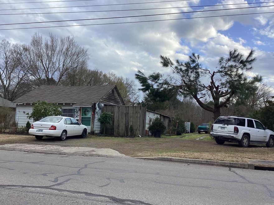 4.7 acres + or - in the city limits.  ll connected on the same block. 3 houses not rentable and one nice 3 bedroom one bath home with green house and large garden!!  Easy access to schools, restaurants , shopping centers and walmart!! Plenty of room to spread out and kids to play!