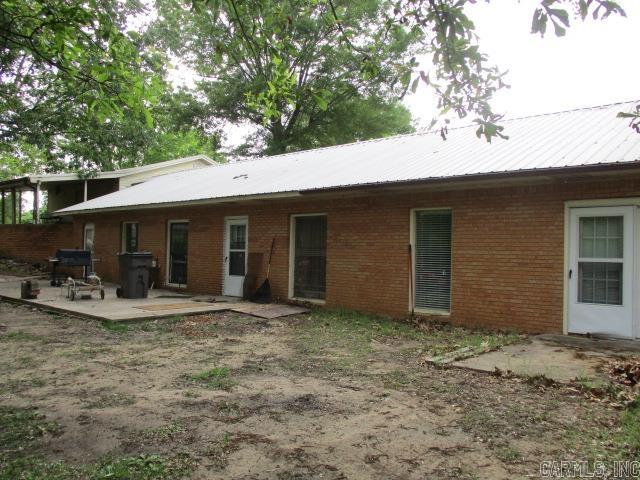 New to the market, a 3 or 4 bedroom 2 bath Earthhome located on 3 beautiful acres in the city. hardwood and tile flooring, Heat Pump was replaced in 2024 and one of 2 water heaters replaced in 2023, in need of some TLC, could be a great home in a great location, attached double garage with 2 auto-open garage doors, Separate 1,232 sq ft shop with additional carport area and lean-to.