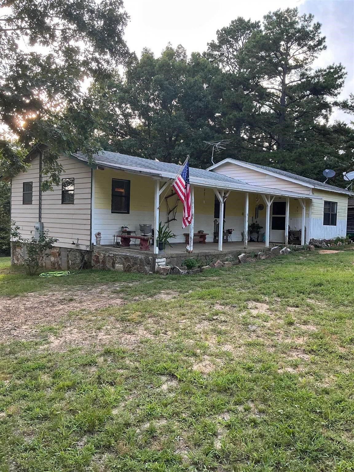 Come check out this beautiful mini-farm nestled in peaceful Poughkeepsie, AR. This property offers mature fruit trees, a versatile barn with loft, large shed with attached enclosed equipment shed, large chicken coup with fenced in run, 2 rabbit hutches, and an extra covered versatile pen for dogs, goats, or whatever. Whether you are an avid hunter or just enjoy watching the wildlife, there is plenty of it here! Deer can be seen almost every evening from the kitchen window and turkeys gobble in the near distance. Inside, the home has 3 bedrooms, large laundry/utility area, handicapped accessible bath tub/shower, hallway shelves, dishwasher, refrigerator, gas stove and gas dryer, and washing machine that all convey. Even though it has a brand new 2.5 ton central heating and air system, it also has back-up ventless gas heaters in the event of a power failure or if you just want that extra boost of heat. This property has so much potential and is mostly fenced. The chickens and rabbits can stay to help get you started. Call today to see this versatile property.