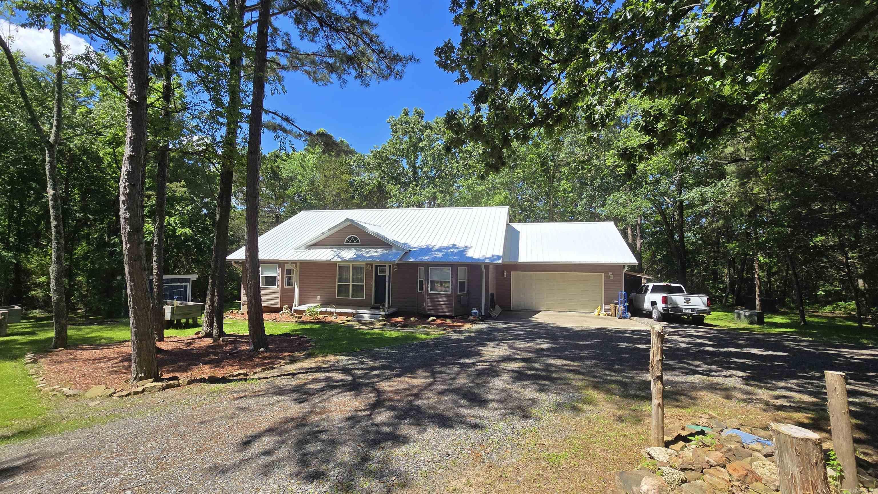 Discover this beautifully remodeled 3-bedroom home, on 5.05 unrestricted acres, featuring a host of new upgrades and modern touches that are sure to impress! Step into the bright, open living spaces with freshly painted walls and trim, complemented by brand-new flooring throughout. The updated kitchen boasts sleek new stainless steel appliances, a large stainless sink, and freshly painted cabinets, paired perfectly with new countertops to create a stylish and functional space. Enjoy the outdoors with freshly painted front and back patios, as well as a brand-new rear deck – perfect for entertaining or relaxing. Additional updates include new light fixtures and ceiling fans for a refreshed, modern feel. The HVAC system has been regularly serviced, ensuring comfort and efficiency year-round. Don’t miss the opportunity to own this move-in-ready home with high-quality finishes and thoughtful updates throughout!