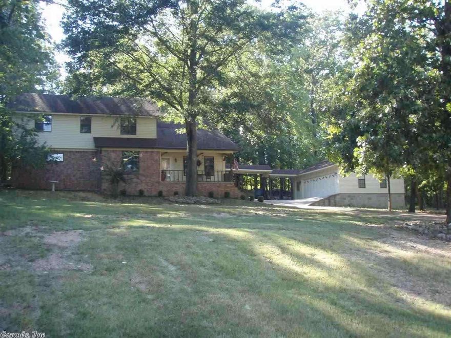 Home sits on two lots with Lake Catherine views.  Property features included: two, two car garages, fire pit with spacious seating area, dining room, breakfast room, sunroom, and private office area off master bedroom and much more. Property is in close proximity to both water and golf activities. Must see!