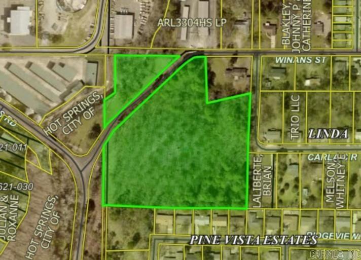 Let your imagination run wild on this acreage in the middle of Hot Springs! Rare opportunity for your "house on a hill" in the middle of town or a possible new subdivision just minutes from Oaklawn. Hot Springs Creek borders the NW corner of the property. Water and sewer lines are on adjoining parcels. Zoned Residential -low density. ( more pictures to com