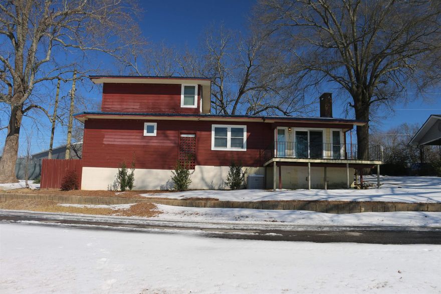 Own your own split-level home with lakefront living in Mena, Arkansas! This 2-bed 2-bath split-level home has open vaulted ceilings with exposed beams, making for a peaceful and relaxing setting in the living/kitchen area. With .26 acres and a deeded easement for lake access, you can relax on or by the water in the warmer months and enjoy some kayaking and fishing. With a deck built off the house overlooking the lake you can enjoy soaking up the serenity. This 2-bed 2-bath home has an office room that could be converted to a storage or baby room as well. The hardwood flooring throughout the home sets the tone. The home is set with a brick fireplace that is gas-operated as well. Central heat and air are established in the home for comfort and ease. With a new metal roof, foundation securing, new plumbing, and all new windows set in place within the last 6 years. Located near the new Mena bike trails, this is your chance to own a slice of lakeside paradise and still be close to all amenities. Reach out for your private showing of this opportunity.