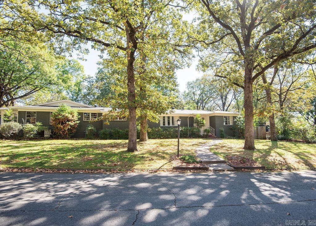 This spacious 3-bedroom, 3-bathroom home is a true Park Hill gem, located on a corner lot that offers city views.The house features two inviting living rooms, providing you with plenty of space to entertain guests, relax with your family, or create versatile living areas to suit your needs. Refinished hardwood flooring, an abundant amount of storage space, new roof in 2021. This home is a perfect blend of functionality, style, and location!