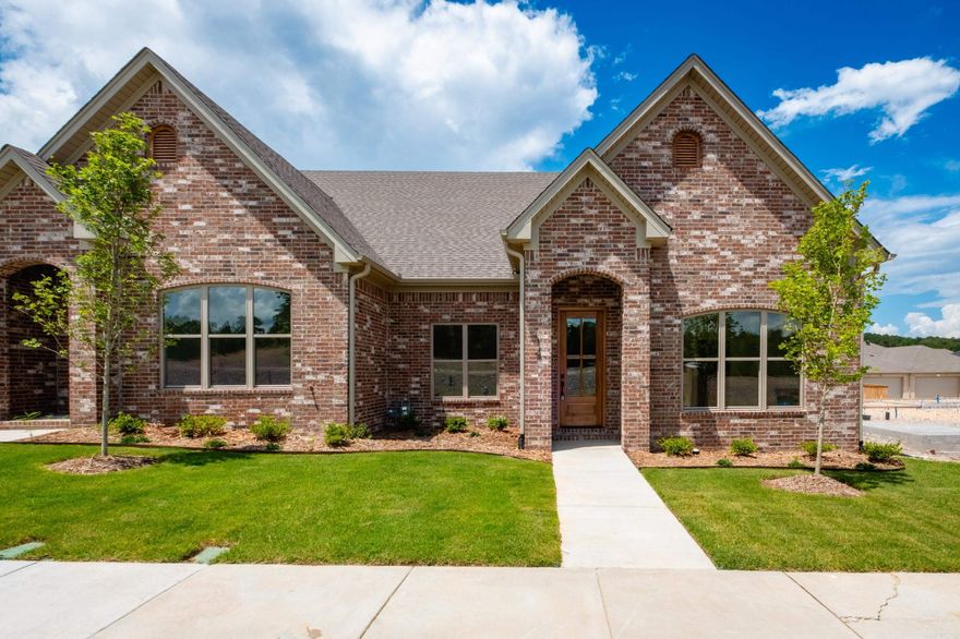 Welcome to Edgewood, West Little Rock’s newest neighborhood where upscale living meets low-maintenance convenience. Built by Graham Smith Construction, this thoughtfully designed 2-bedroom, 2-bath attached home with bonus space, offers modern comfort with no yard work required as lawn care is included. Step inside to a bright, open-concept layout with designer finishes at every turn. The living area features a cozy fireplace and flows seamlessly into a sleek kitchen outfitted with quartz countertops, custom cabinetry, stainless steel appliances, and a stylish tile backsplash. Luxury vinyl plank flooring runs throughout the home, adding warmth and durability. The primary suite is a calming retreat with a spacious walk-in closet, a large vanity, and a tiled shower. Enjoy outdoor living on your private, covered patio, perfect for morning coffee or evening unwinding. A 2-car garage adds parking and additional storage. Located just 3 minutes from Costco! Edgewood offers easy access to all that Little Rock has have to offer. With early-phase availability, now’s the time to invest in this beautiful new community.