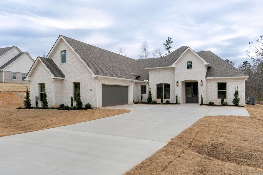 $7,500 Buyer closing costs paid with an acceptable offer. Luxury living in the premier gated community of Charleston Place. Discover the perfect blend of elegance and comfort with this stunning new home nestled on 1.32 acres. As you enter you are greeted by the formal dining room, perfect for hosting dinner parties. Moving into the heart of the home the open kitchen concept flows into the living room that includes a corner fireplace that creates a warm atmosphere. The kitchen includes an oversized island with bar seating, high end appliances, quartz tops and custom cabinetry. The primary suite offers a private retreat designed for comfort and luxury. The bath is a spa like retreat with a freestanding soaker tub and walk in shower. All this and much more. Agents see remarks.