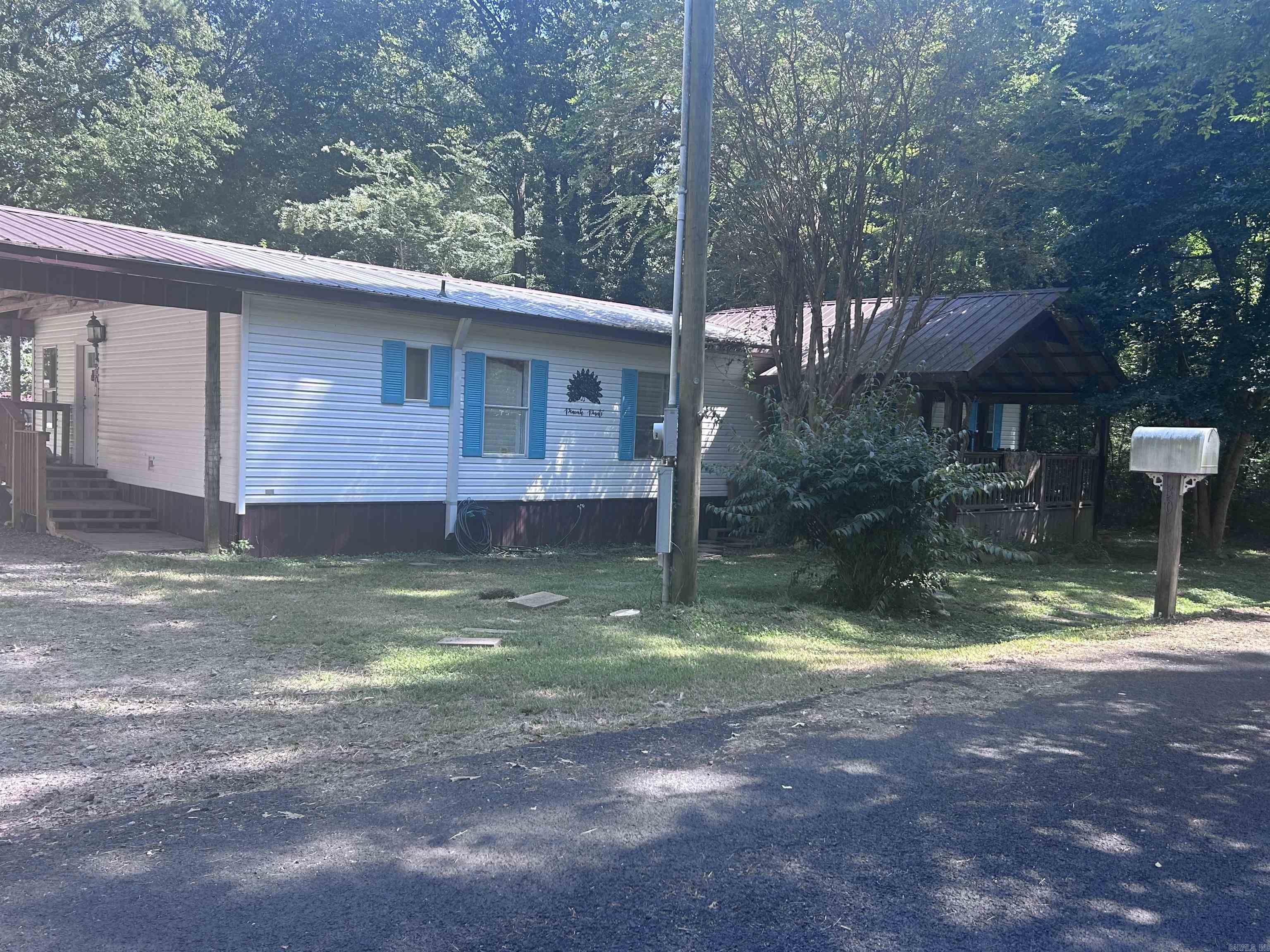 Charming 3BR/2BA Mobile Home ā Perryville, AR Just a short walk to Harris Brake Lake, this spacious home features a large living room, big kitchen with pantry, oversized master suite with private bath and ample closet space, laundry room, and 2-car carport. Updates include wide plank flooring, new HVAC (2021), and metal roof (2018). Relax or entertain on the large covered front and back decks. Backyard is shaded and fully fenced and includes a 12x12 storage shed. Peaceful location, great for everyday living or a weekend retreat. Shown by appointment only.