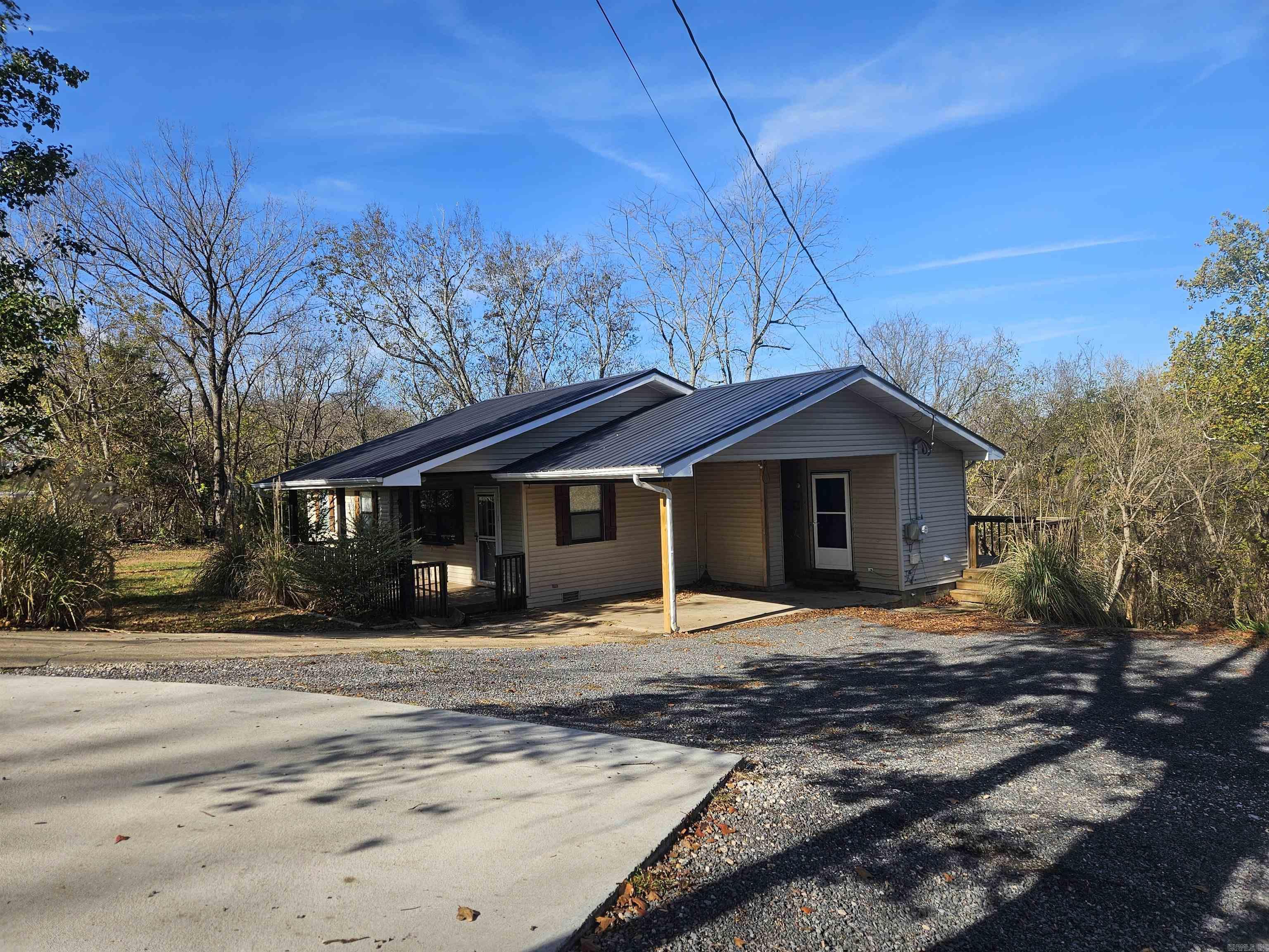 Beautiful, well built, well maintained, updated, and MOVE-IN-READY home in Marshall, Arkansas!  Located in the breathtaking OZARK MOUNTAINS, and very close to the BUFFALO NATIONAL RIVER! . It's a 3-Bed, 2-Bath Ranch style home with a huge back yard.  It has a beautiful, well organized kitchen perfect for family living. Enjoy morning coffee, meals & outdoor relaxation on the large deck that overlooks a huge backyard that back up to peaceful woods. Located in the heart of Marshall, you'll be close to great schools, a wonderful library, dining, a large medical clinic, and the Buffalo National River. Ideal for those seeking a quiet, nature-filled lifestyle with easy access to local amenities. A true gem in the Ozarks! If you have been praying for a nice home in a small town, then this could definitly be it.  It's a dream come true.  If this home is in your budget, call today, and arrange to see it! Will pass FHA, RD, VA loans. We can help with lenders & will guide you every step of the way! We do all the work! searcycountyarkansas.org  https://www.nps.gov/buff/index.htm