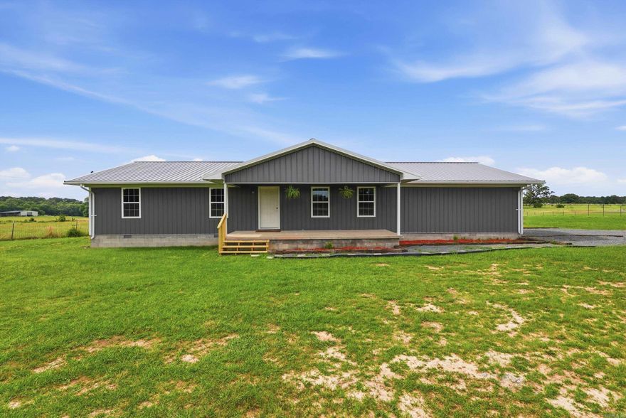 Completely renovated 4 bedroom, 2 bath ranch-style home on 2 beautiful acres in Damascus! This property offers wide open country living with sweeping panoramic views and incredible sunsets right from your back porch. The home features a low-maintenance exterior with metal siding, metal roof, updated windows, and a new septic system. Inside, you’ll find a completely refreshed interior with new HVAC, appliances, granite countertops, updated finishes, and a clean, modern feel throughout. The flat and usable 2 acre tract provides plenty of room for a garden, shop, or simply enjoying the space and privacy of country living. If you’ve been looking for an updated country home with land, views, and affordability, this property is a must-see! Call or text today to schedule your private showing. Agent Owned.