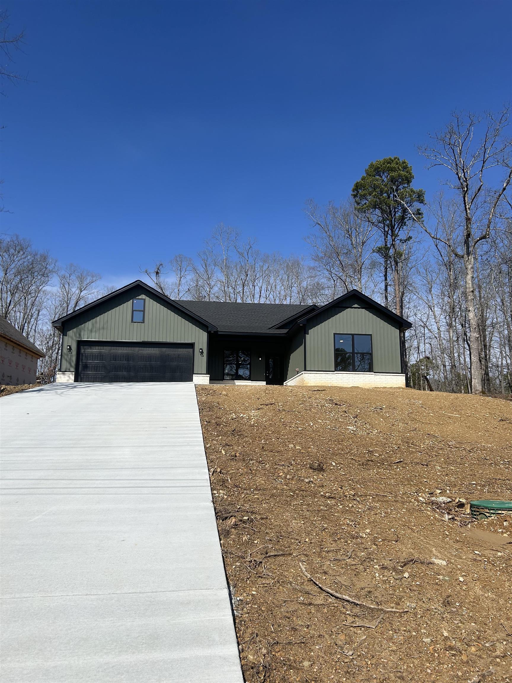 Brand new construction home located in the gated Diamondhead Resort Community. Three bedroom, two bath home with two car garage. Open floor plan with covered back porch. Grass seed will be coming as soon as weather permits. Diamondhead Resort Community amenities include an 18 hole golf course, Olympic size swimming pool, tennis/pickleball court, basketball court, playground area, disc golf course, workout facility, clubhouse, boat launch/lake access points and hiking in Lake Catherine State Park. Lakeside school district.