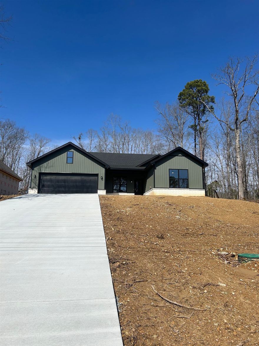 Brand new construction home located in the gated Diamondhead Resort Community.  Three bedroom, two bath home with two car garage.  Open floor plan with covered back porch.   Grass seed will be coming as soon as weather permits.  Diamondhead Resort Community amenities include an 18 hole golf course, Olympic size swimming pool, tennis/pickleball court, basketball court, playground area, disc golf course, workout facility, clubhouse, boat launch/lake access points and hiking in Lake Catherine State Park.  Lakeside school district.