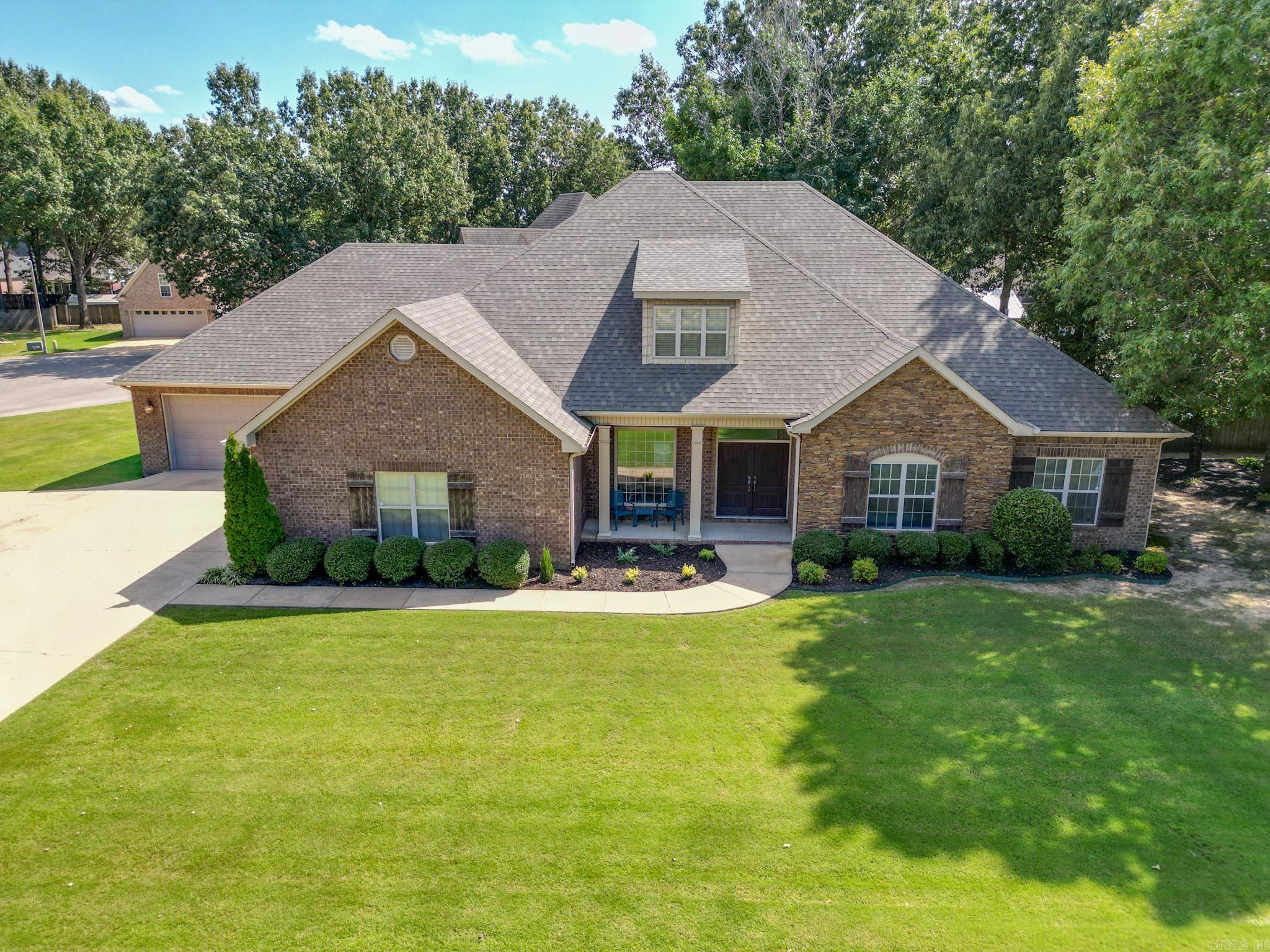 Set on a generous 0.48-acre corner lot in the sought-after Valley View School district, this stunning 5-bedroom, 3.5-bath home combines elegance, comfort, and versatility. The property features two double garagesāincluding one that is heated, cooled, and equipped with a workshop areaāideal for hobbies, storage, or extra vehicles. Inside, youāll find formal and breakfast dining areas, a welcoming hearth room, a handy mud room, and a grand master suite with bay windows, a walk-in shower, a separate tub, and a closet that can double as a storm shelter for peace of mind. Recent updates include freshly painted trim and new flooring, lending a crisp, contemporary appeal throughout the home. Upstairs, a flexible living space and a bedroom with ensuite bath offer privacy for guests or family members. Step outside and enjoy an inground saltwater pool with relaxing fountains, an extra-large patio perfect for hammocks, games, or entertaining, a covered back porch for shaded comfort, and a beautiful, landscaped yard bordered by mature trees and a privacy fence. New roof 11/2023. Almost new AC units (4). Thoughtfully designed for entertaining, relaxing, and everyday family living.