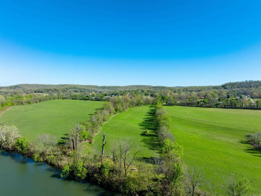 If you’ve been searching for usable land on the Spring River, this 9.57 +/-  acre property just outside Hardy, Arkansas (Sharp County) is a rare find. Offering two adjoining parcels, this tract features flat, accessible ground with direct river frontage—a combination that is getting harder to find. The land is predominantly level and easy to navigate, making it ideal for a future homesite, camper setup, weekend retreat, or recreational property. A mix of open ground and tree lines provides both usability and privacy. This property offers year-round enjoyment. Hunt in the fall and winter with wildlife moving through the area, then enjoy fishing, floating, and kayaking on the Spring River during the warmer months. Located just minutes from Hardy, AR, and a short drive to Jonesboro, you get the perfect balance of peaceful Ozark living with convenient access to town. With direct Spring River frontage and strong potential for recreation or investment, this is a great opportunity for buyers looking for riverfront land with usability and value. Equal Housing Opportunity