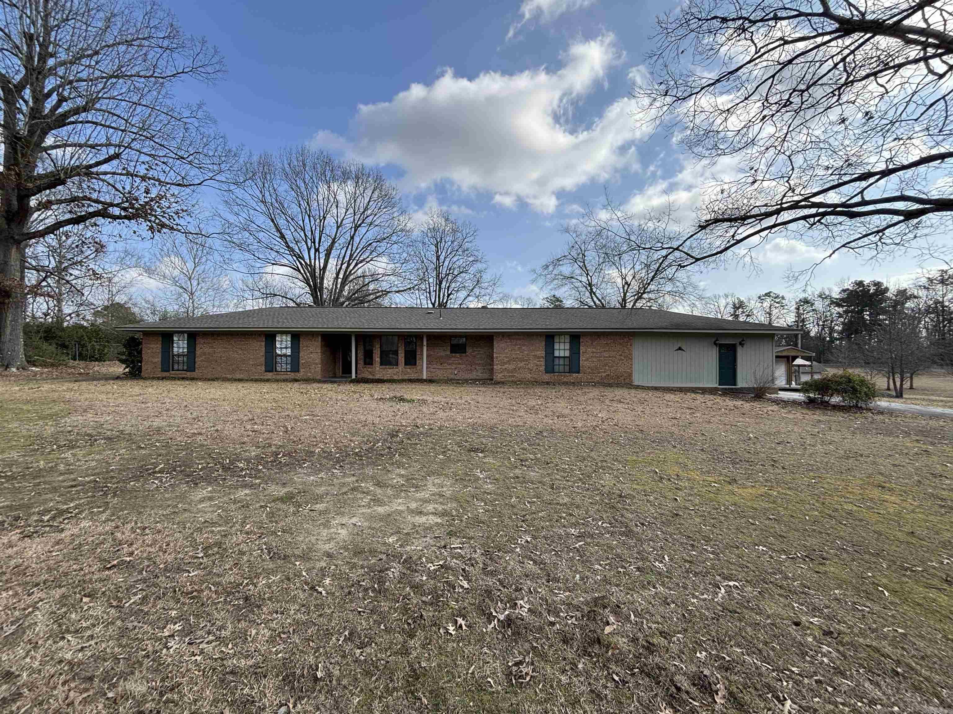 Nestled on over 7 acres of fully fenced land, this incredible property offers an exceptional combination of storage, comfort, and outdoor living. Whether you're looking for a hobby farm, or just a peaceful retreat, this property has it all. With a variety of storage options, including many with electrical wiring for added convenience it makes it perfect for hobbyists, contractors, or anyone needing extra space. One of the buildings is a 30'x40' shop fully equipped with A/C, heat, and electricity, making it an ideal space for year-round projects or a workshop. The property features a serene, stocked pond perfect for fishing, wildlife viewing, or simply relaxing by the water. You can also enjoy the outdoors in comfort with a spacious covered deck, ideal for entertaining, dining, or unwinding after a long day. Call or text today to get your showing scheduled.