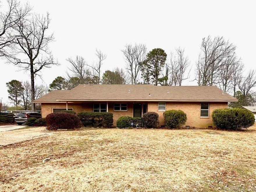 This Classic Brick Home, has Exceptional Craftmanship. Solid wood walls in the Living areas boasts of warm, historic beauty. The Living and Dining Room feature a large wood burning fireplace. As well as large sliding glass doors that open to the back covered patio. Perfect for entertaining. The original hard wood floors throughout are in excellent shape. The Kitchen and Bathroom are updated. Counter tops, backsplash, cabinets, flooring, etc... At 1427sf, You must see this 2 bed and 1 bath home to appreciate all it has to offer!