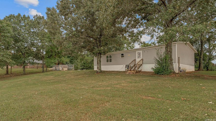 Spacious 4-bedroom, 2-bath mobile home situated on a full acre, offering both comfort and room to grow. This property features an open floor plan with a large living area, a functional kitchen with plenty of cabinet space, and a split-bedroom layout for added privacy. The primary suite includes a private bath, while three additional bedrooms provide space for family, guests, or a home office.    Enjoy the peace and privacy of country living with plenty of outdoor space for gardening, recreation, or future additionsall just a short drive from town conveniences.
