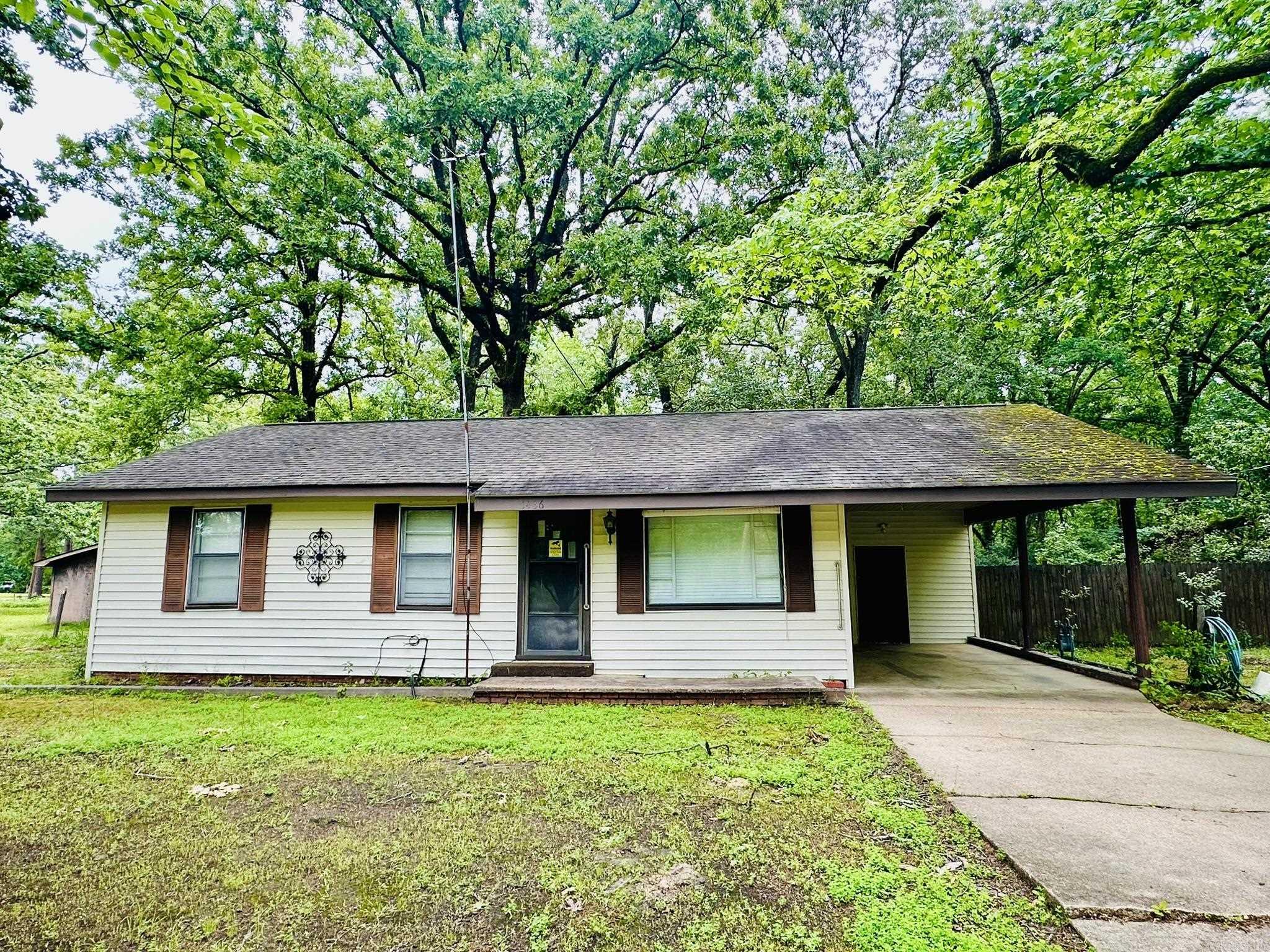 Looking for a great investment? This property has two homes on it. One is an older 840 sq ft house with 3 bedrooms and 1 bathroom. Newer walk-in shower. Laundry room is located under to carport and also has a covered patio. The ac/heat wall unit is about a year old. All appliances will convey. Both properties sit on 1.14 acres (corner lot) which includes a large shop with electricity. Second home has 480 sq ft (physical address is 405 W Pierce). Kitchen/living room and one bedroom and one bathroom. The bathroom needs some TLC. Roof and plumbing work need to be done. Appliances will also convey with the smaller home. Properties are being sold together and will be sold "AS IS".