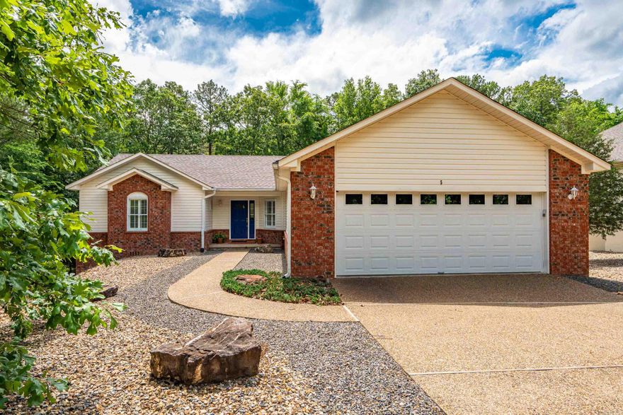 This well-maintained 3-bedroom, 2-bath home, located on the east end of the village, includes 1,830 sq. ft. with an open floor plan, vaulted ceilings, and a mix of wood, carpet, and tile flooring. It features split bedrooms, a screened porch, an Arkansas room, a storm shelter in the garage, and a storage room in the crawl space. The property has maintenance-free landscaping, and updates include a new roof in 2023, exterior paint in 2022, a heat pump in 2016, refrigerator and microwave have been replaced. Priced at $309,500