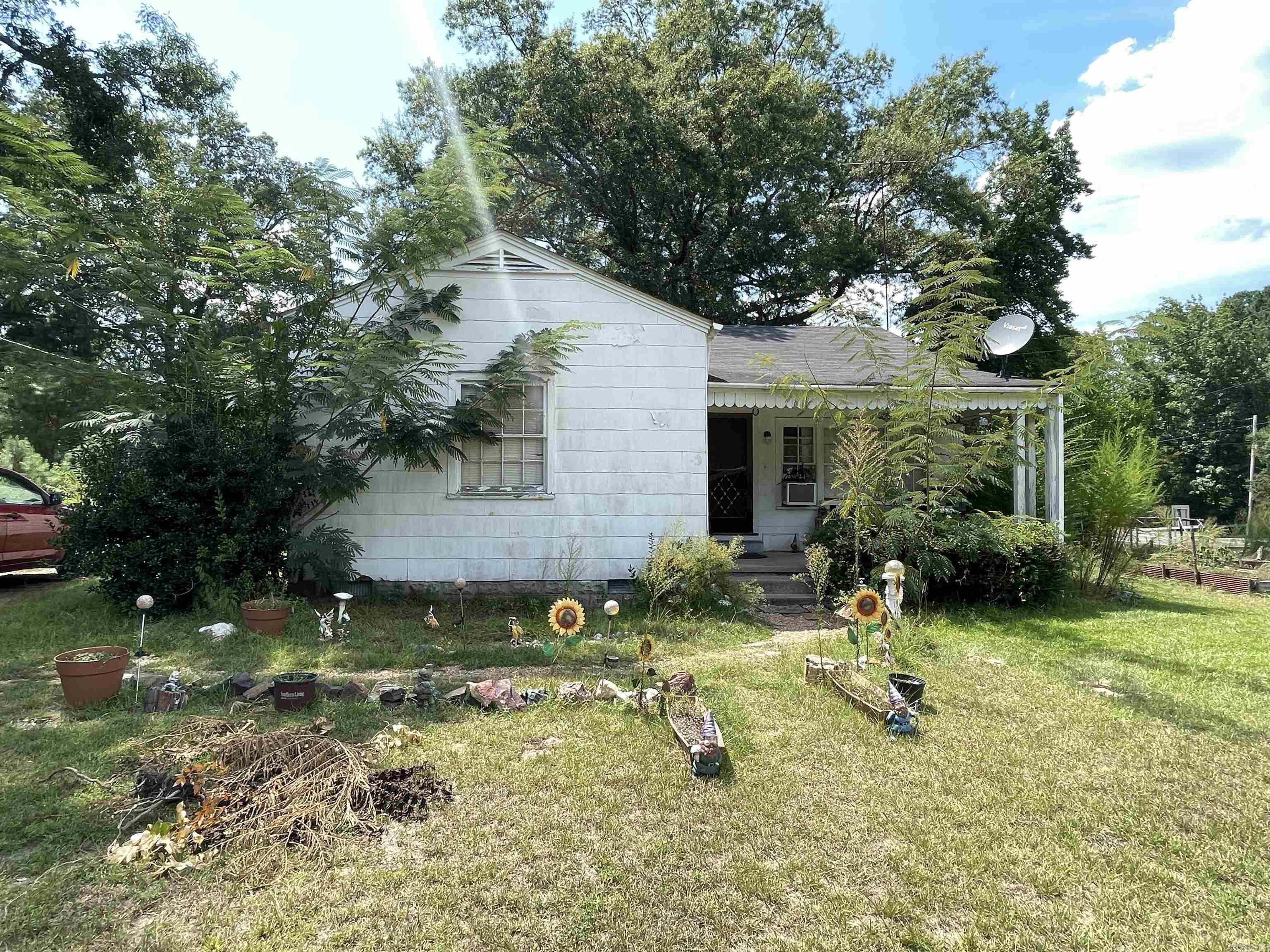 Opportunity awaits with this diamond in the rough! Situated on over 2 acres of land, this property offers the perfect canvas for your vision. Whether you're an investor, builder, or homeowner looking to create your next retreat, the possibilities are endless. The home needs work but offers solid bones and a layout full of potential. With plenty of space to expand, garden, or even add outbuildings, you'll love the freedom and privacy this large lot provides. Get a head start with new gas stove and stainless steel fridge! Located in a peaceful setting yet conveniently close to town, this is your chance to turn a fixer-upper into something truly special. Bring your tools and imaginationāthis one won't last