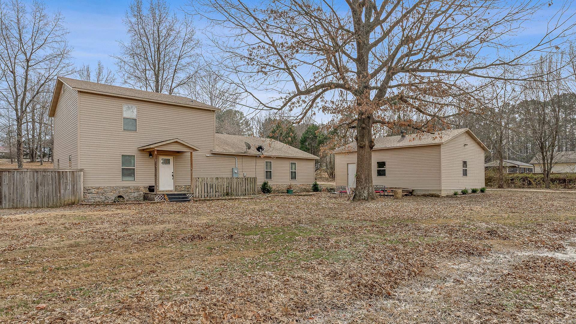 This one owner home sits on 1 acre in a sought after location, nestled near cornbread corner with lots of elbow room. Featuring 3 bedrooms, 2.5 bathrooms, an office (or 4th bedroom), 2 living spaces, a spacious kitchen with ample counter space, separate dining space and breakfast nook, large laundry and a super fun put-put golf area that can be easily moved if you prefer! (it was made to just sit in that space)  When you have had your share of fun inside enjoy the privacy of a fenced in backyard and the versatility of a detached 2 car garage/shop. This house is welcoming and has the character to make it a HOME!