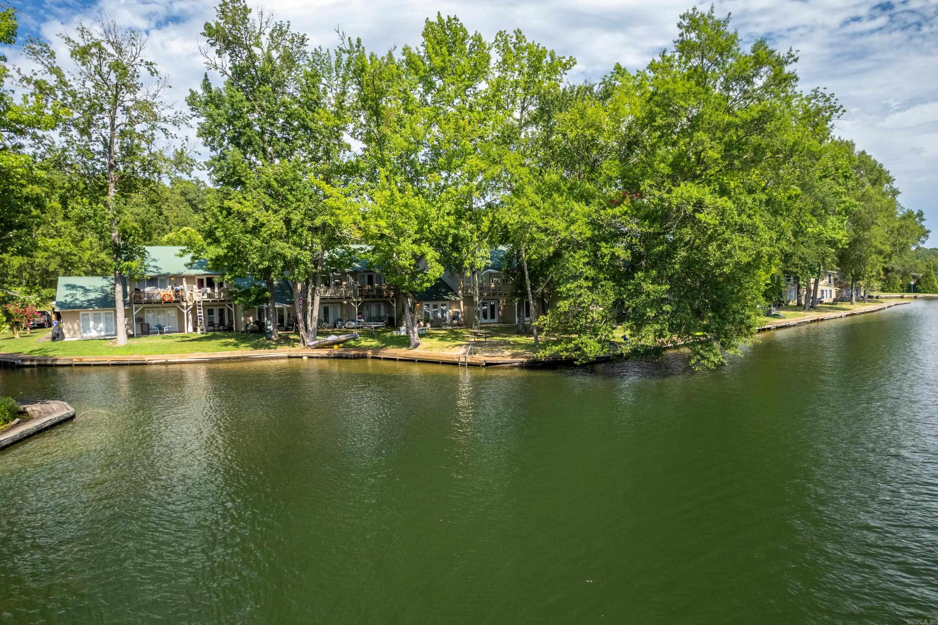 Rare opportunity to own Lakefront Property 30 feet from waters edge at a low, low price that is affordable!. Highly sought after Ground floor. Cozy 1 Bed 1 Bath Condo has been completely remodeled. New Paint, fixtures and New Luxury Vinyl Flooring. Refrigerator, oven and new dishwasher remain. Fantastic Lake Views from inside or Back Porch. New beautiful Boardwalk surrounds the entire property. Great for Fishing or for Boating. No stairs or even steps anywhere! Tankless Water Heater. Water paid by POA. Well managed POA. AirBnB's and Short Term Rentals are allowed.