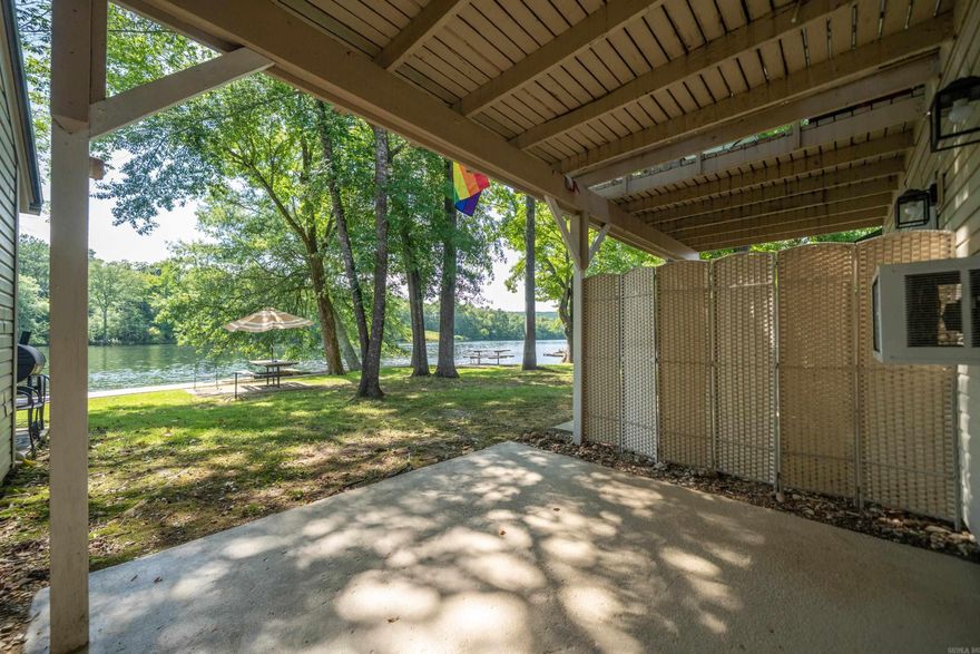 Rare opportunity to own Lakefront Property 30 feet from waters edge at a low, low price that is affordable!. Highly sought after Ground floor. Very beautiful and peaceful place on Lake Hamilton.  Cozy 1 Bed 1 Bath Condo has been completely remodeled. New Paint, New Fixtures, and New Luxury Vinyl Flooring. Refrigerator remains. Fantastic Lake Views from inside or Back Porch. New beautiful Boardwalk surrounds the entire lake front property.  Great for Fishing or for Boating. Gated Property. No stairs or even steps anywhere to trip over. Tankless Water Heater. Water paid by POA. No used furniture to throw away, ready for fresh new furnishings to your taste. AirBnB's and Short Term and Long term Rentals are allowed with No required Permit.