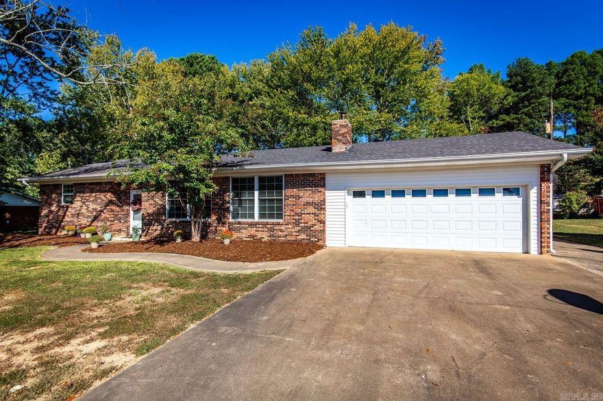 Country living in town.  Beautiful home located on large lot featuring 3 bedrooms and 2 1/2 baths.  Spacious kitchen with Granite countertop.  Master Bedroom with bath and large walk-in closet.  Open living room features lots of natural light with view of beautiful pastoral setting and working fireplace with wood hopper and ash disposal that may be accessed from outside.  Large laundry room and lots of closet space throughout.  Work at home in 720 sq. ft. fantastic shop on concrete slab with heat/air and loft with ample storage space or would make a perfect mother-in-law quarters.  Approximately 1/2 acre, that is back part of the Lot with shed, would make a great place for animals.   ONLY 18 minutes to Conway which has lots of nice dining places, 3 colleges, and great shopping.  Conway Hospital and the Baptist Hospital.  Also 31 min to Greers Ferry Lake and Recreational Area for great fishing and just enjoy playing in the water.  2 hours 34 min to Branson MO.