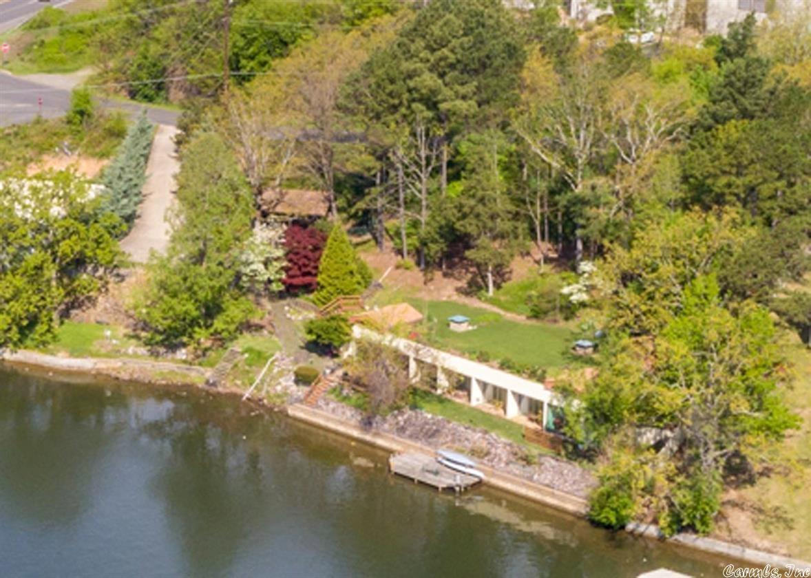 A truly unique lake home experience is awaiting you. This earth home designed by Bernie Leider features over 2700 sq ft of underground living space nestled in the shoreline of Long Island. A geothermal system maintains the perfect indoor environment with ease. Over 200 ft of shoreline. The grass rooftop provides ample room for outdoor entertaining, additional structures or even space for a pool is desired.