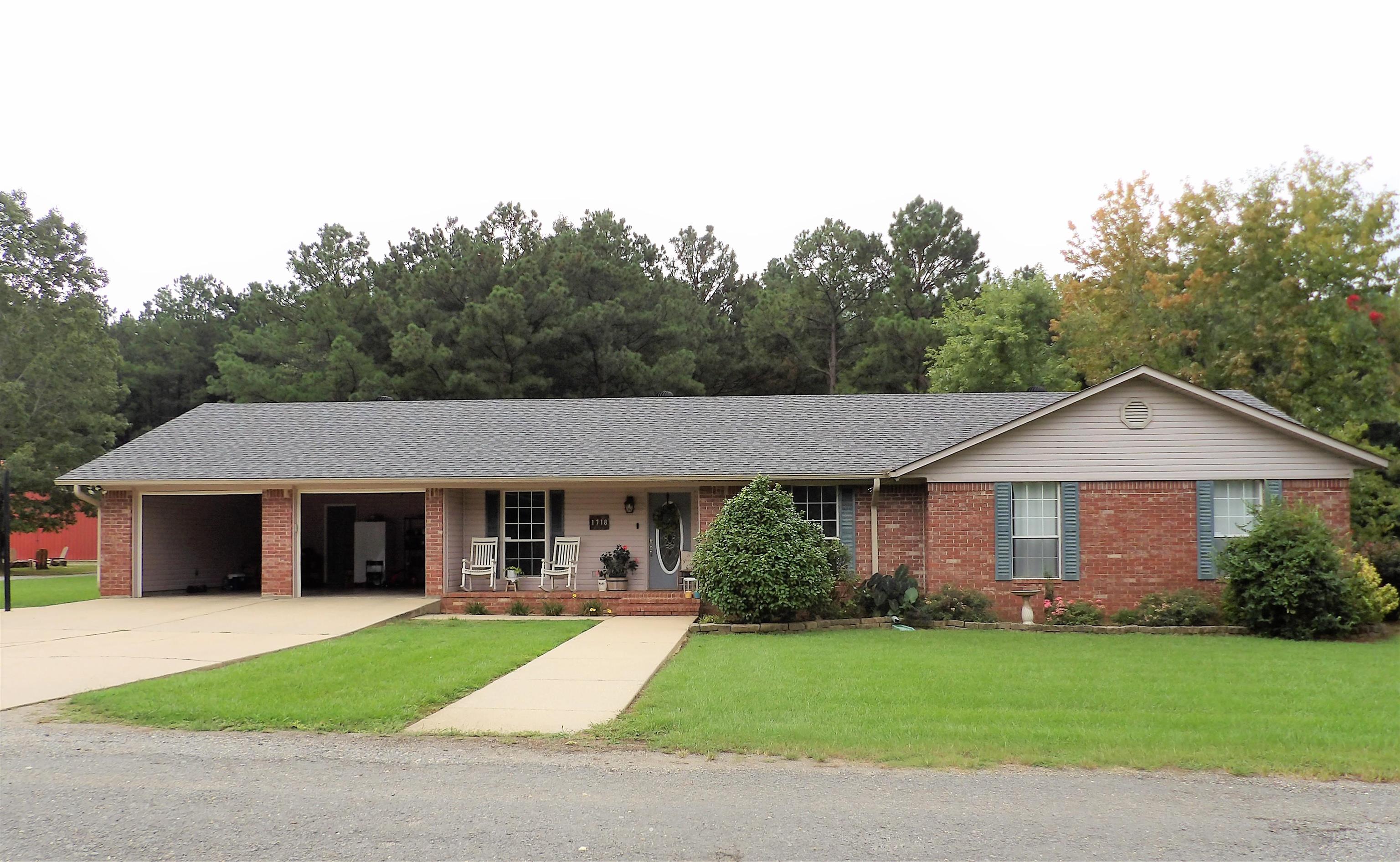 Motivated sellers have reduced the price on this relaxing get-away at the end of the road where no through traffic will disturb your peaceful tranquility. This home offers 4 bedrooms, 2 baths, 2049sf and situated on 4 acres (mol). Open concept living room, dining and kitchen. Kitchen offers rows of cabinets, gas stove, dishwasher, granite & quartz countertops, tile flooring and has a cozy breakfast nook. Living room offers vaulted ceiling, wood flooring and accesses the home's backyard and patio. Main bedroom ensuite offers a tub/shower combination, while the hall bath serves the remaining 3 bedrooms. Enjoy the peaceful backyard with the nice barn approximately 66x48 with room enough for all your needs or animals. There is even a nice garden area! This home is waiting for you! Location is convenient to schools, University, hospital, doctor's and dentist's offices. Call for your appointment today!