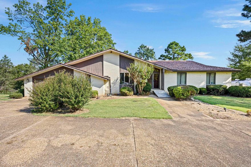 Escape to the peace and beauty of the countryside with this spacious 4-bedroom, 3-bath brick home situated on 40 picturesque acres along Highway 28 in Ola. Offering more than 2,400 sq. ft. of living space, the home features an inviting floor plan with hardwood and laminate flooring, four wood-burning fireplaces, and a bright kitchen with modern appliances. A separate in-law quarters with its own entry provides the perfect setup for extended family, guests, or even rental income. Multiple outdoor living spaces invite you to relax and take in the scenic surroundings. The land is equally impressive, offering 40 acres of opportunity for a hobby farm, hunting retreat, or simply a private escape. Two ponds, fencing, and plenty of open space make it ideal for livestock or recreation. Located next to Two Rivers Schools and just a short drive to Russellville, this property combines the best of privacy and convenience. Don’t miss your chance to own this rare country retreat.