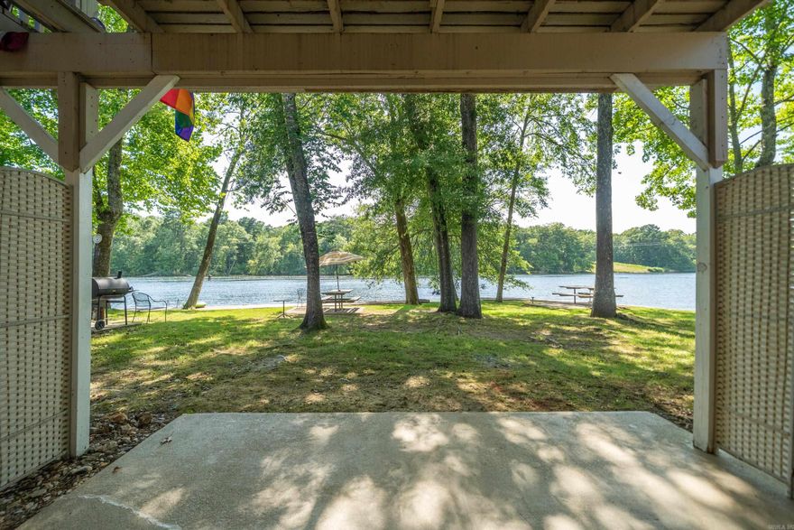 Rare opportunity to own Lakefront Property 30 feet from waters edge at a low, low price that is affordable!. Highly sought after Ground floor. Very beautiful and peaceful place on Lake Hamilton.  Cozy 1 Bed 1 Bath Condo has been completely remodeled. New Paint, New Fixtures, New Quartz countertops and New Luxury Vinyl Flooring. Refrigerator remains. Fantastic Lake Views from inside or Back Porch. New beautiful Boardwalk surrounds the entire lake front property.  Great for Fishing or for Boating. Gated Property. No stairs or even steps anywhere to trip over. Tankless Water Heater. Water paid by POA. No used furniture to throw away ready for fresh new furnishings to your taste. AirBnB's and Short Term and Long term Rentals are allowed with No required Permit.