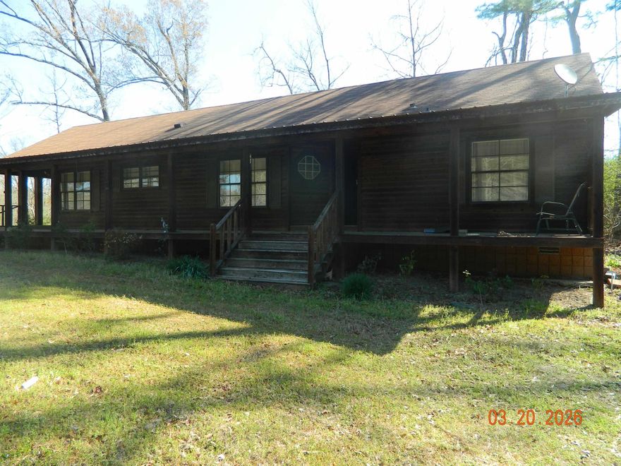 Nice Country Home on 4 Acres, Log Siding,  3 Bedrm 2 Bath. Outside Storage Building/ Shop, Newer Roof. Open Concept ,Woodburning Fire Place.  Enjoy the Wildlife, Plum Trees ( Jelly Making Time). Large Front Porch.... A Hop, Skip, And Jump To Town. Priced to Sell!   Call for A Showing!
