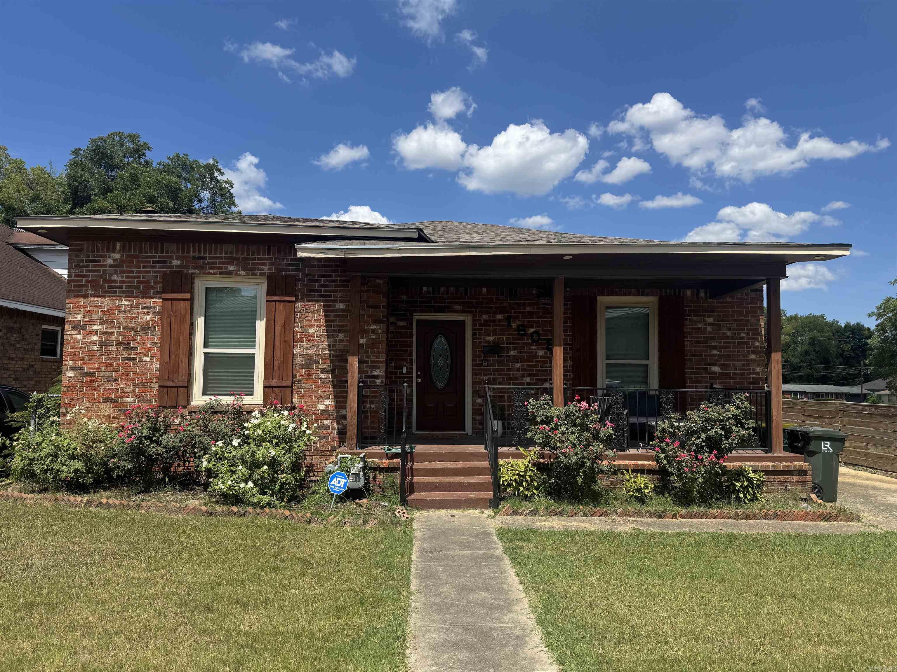 Welcome to this stunning 2-bed, 2.5-bath brick home in Little Rock, offering 1,581 sq ft of modern living! Located just minutes from all the shopping, dining and fun Downtown has to offer. Just a hop across the river from the Argenta Arts District. Close to UAMS and Children's Hospital. - New Roof, New AC and Furnace, New Fencing and New Hot Water Tank! - Step into an open-concept layout with gleaming hardwood floors, elegant tray ceilings, and a chic chandelier in the living area. The gourmet kitchen features stainless steel appliances, granite countertops, a large island with a breakfast bar, and white cabinetry. The primary suite impresses with tray ceilings, ample light, and a serene ensuite bath with a sliding barn door and walk-in shower! The second bedroom is perfect for guests or a home office. Outside, enjoy a well-kept lawn, a charming front porch, and a private and very spacious fenced backyardāideal for relaxing or entertaining.