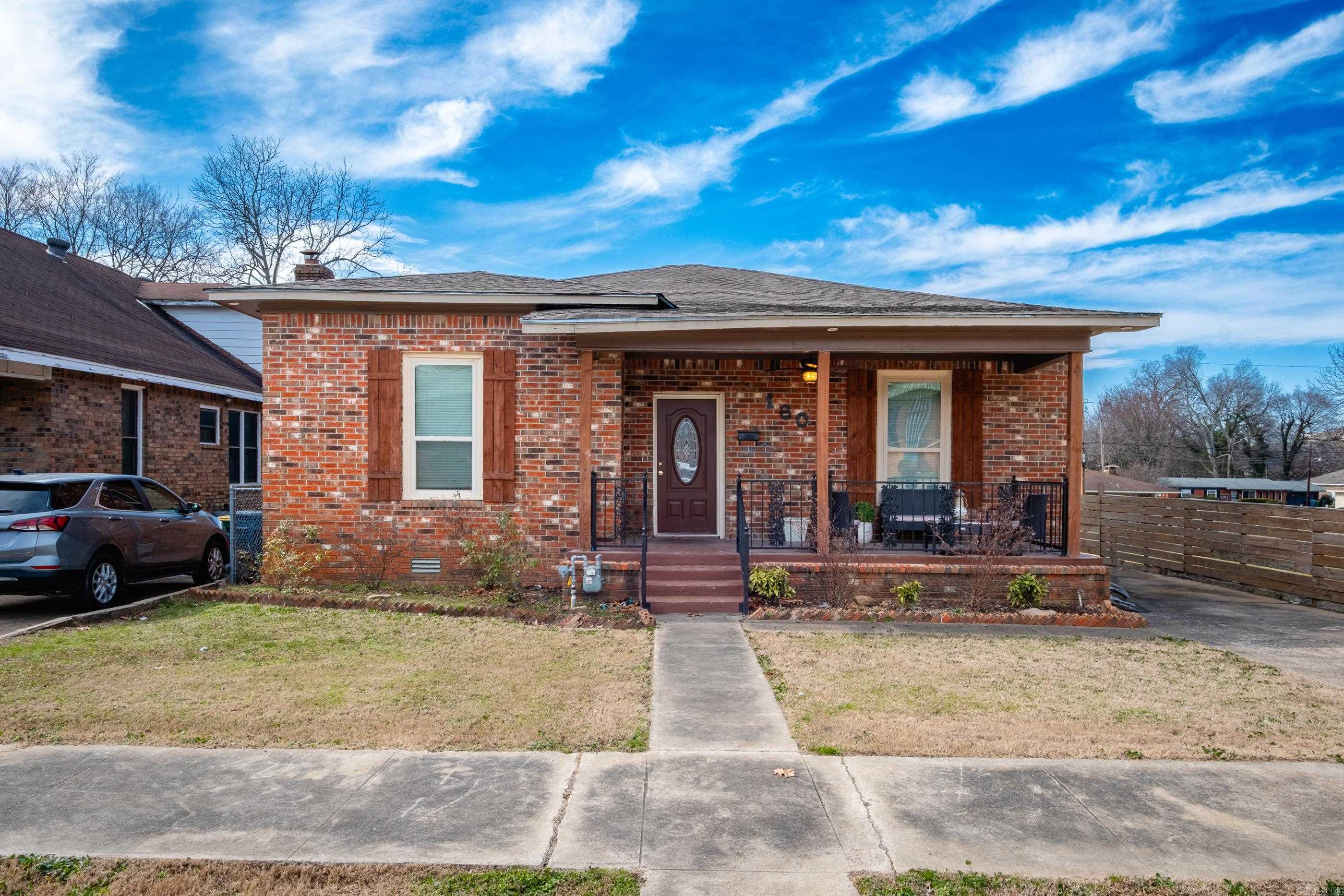 Welcome to this stunning 2-bed, 2.5-bath brick home in Little Rock, offering 1,581 sq ft of modern living! Located just minutes from all the shopping, dining and fun Downtown has to offer. Just a hop across the river from the Argenta Arts District. Close to UAMS and Children's Hospital. - New Roof, New AC and Furnace, New Fencing and New Hot Water Tank! - Step into an open-concept layout with gleaming hardwood floors, elegant tray ceilings, and a chic chandelier in the living area. The gourmet kitchen features stainless steel appliances, granite countertops, a large island with a breakfast bar, and white cabinetry. The primary suite impresses with tray ceilings, ample light, and a serene ensuite bath with a sliding barn door and walk-in shower! The second bedroom is perfect for guests or a home office. Outside, enjoy a well-kept lawn, a charming front porch, and a private and very spacious fenced backyardāideal for relaxing or entertaining.